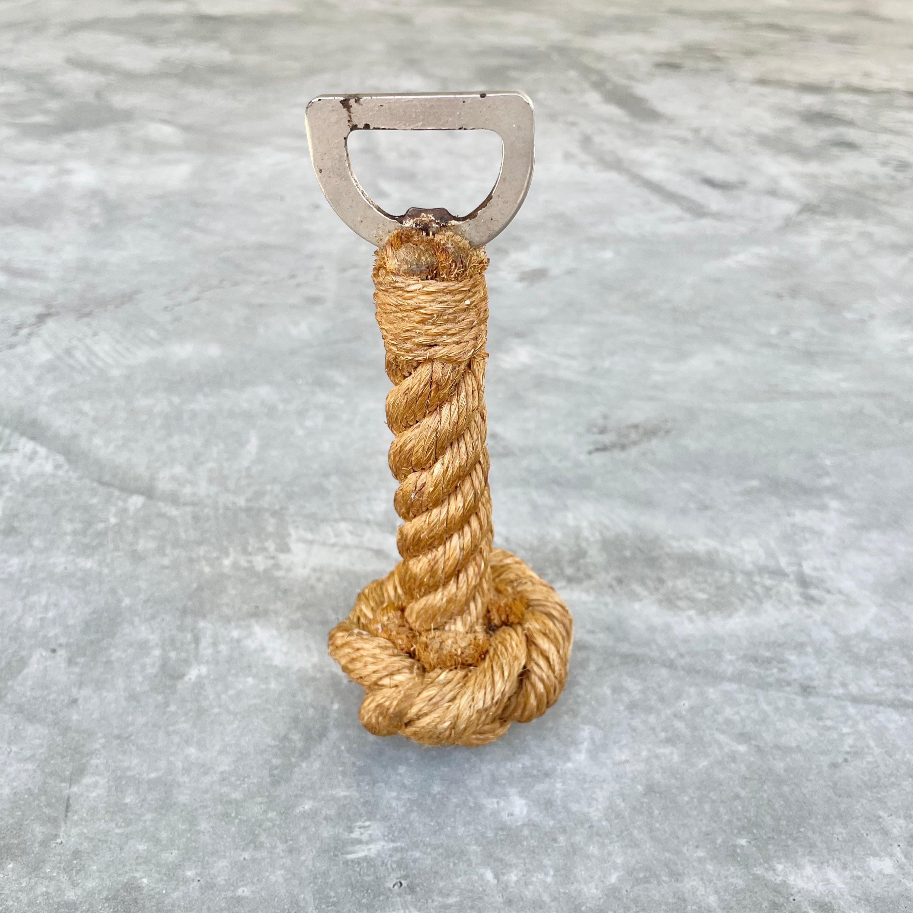 French rope bottle opener by Audoux and Minet. Thick intertwined rope with bottle opener on one end. Stands up on its own. Fun piece of collectible barware. Good vintage condition. 

