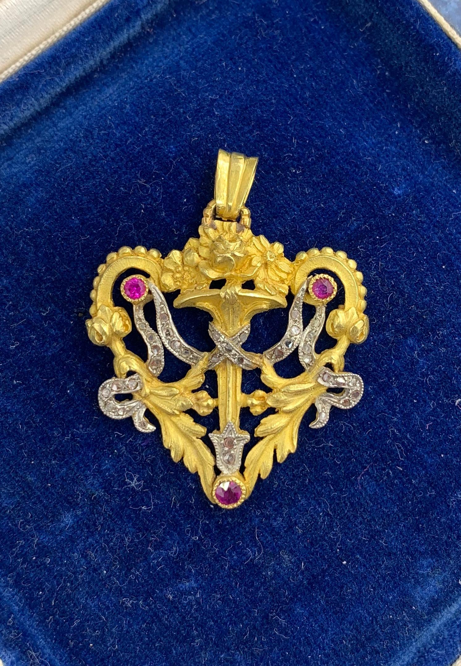 This is a stunning and rare antique Heart motif French Belle Epoque Rose Cut Diamond and Ruby 18 Karat Gold Pendant Necklace.   The gorgeous heart shape pendant has all the elements of the French Napoleon III jewels that we love, the exquisite