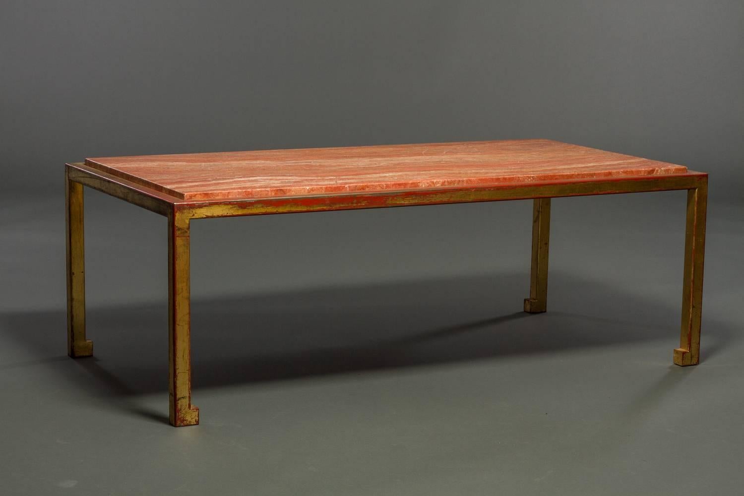 French 1940s Gilded Bronze and Marble Cocktail Table.  A gilded frame with red undercolor and a beautiful veined rose marble top inset.