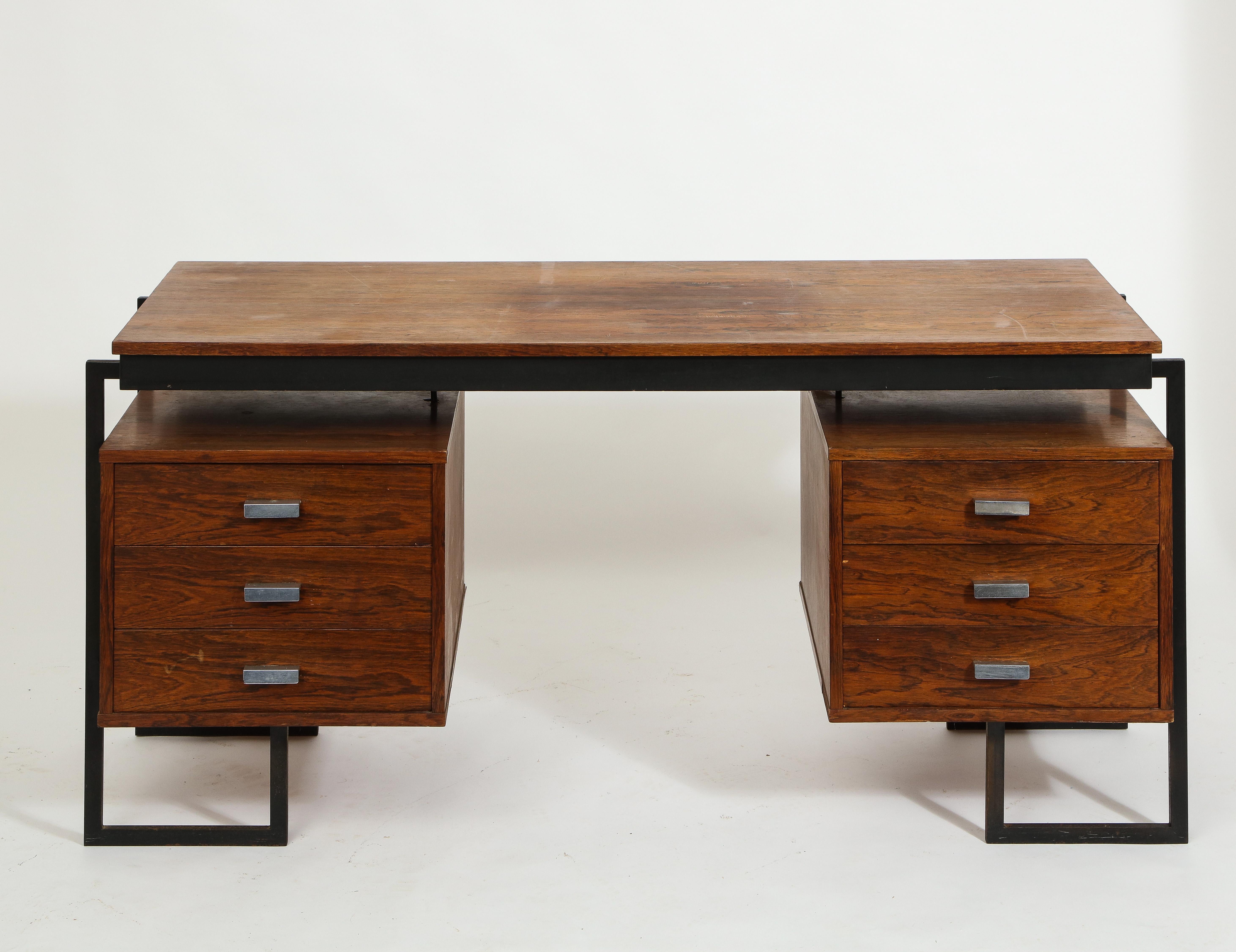 Six drawers French desk in rosewood and enameled steel, aluminum pulls, metal skirt under the top, it can be floated as it's finished on both sides.

Full restoration can be quoted upon request.