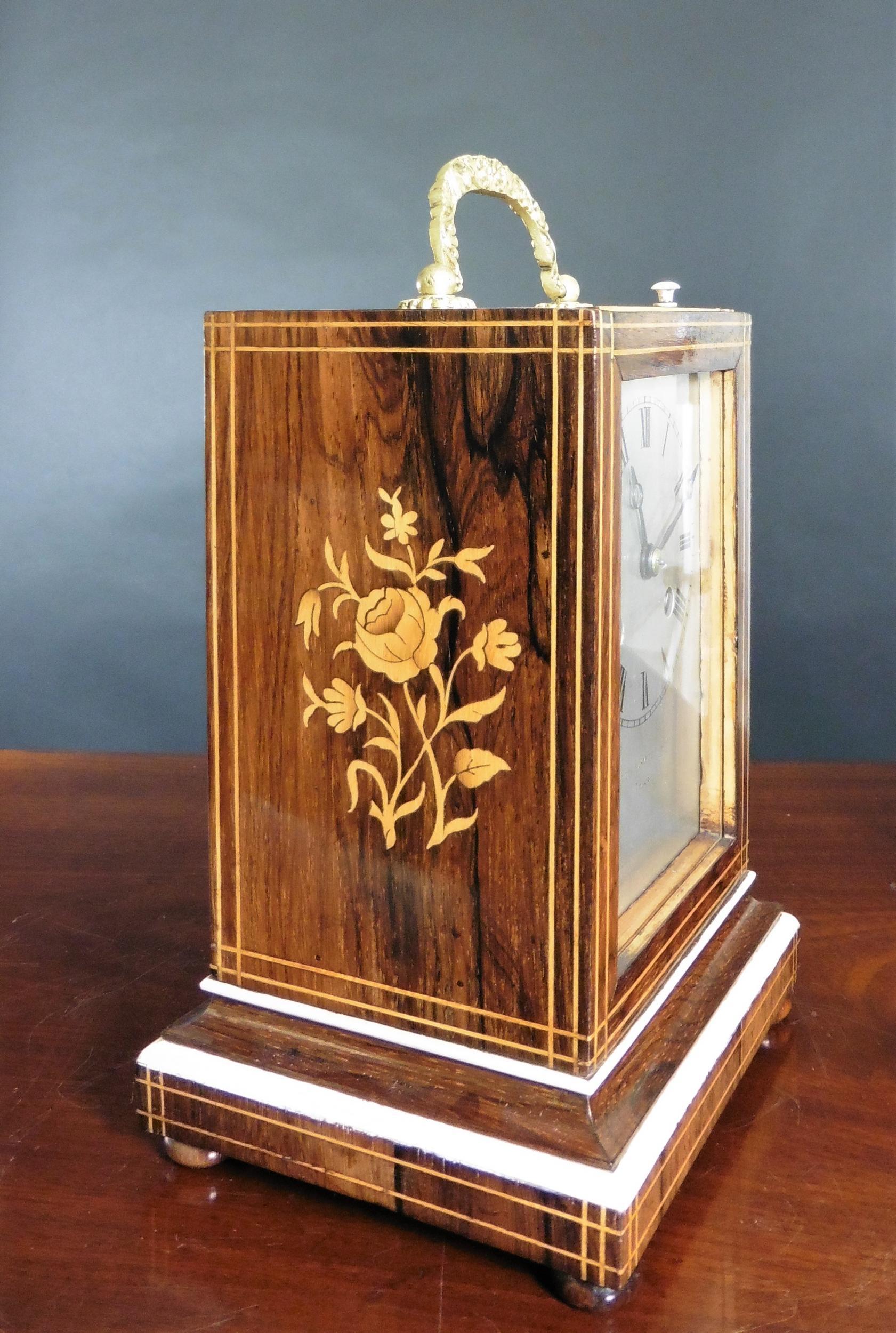 French rosewood campaign clock

French campaign clock in a finely figured rosewood case standing on a raised moulded plinth, both sides inlaid with satinwood floral decoration and resting on four turned bun feet.

Glazed opening front revealing