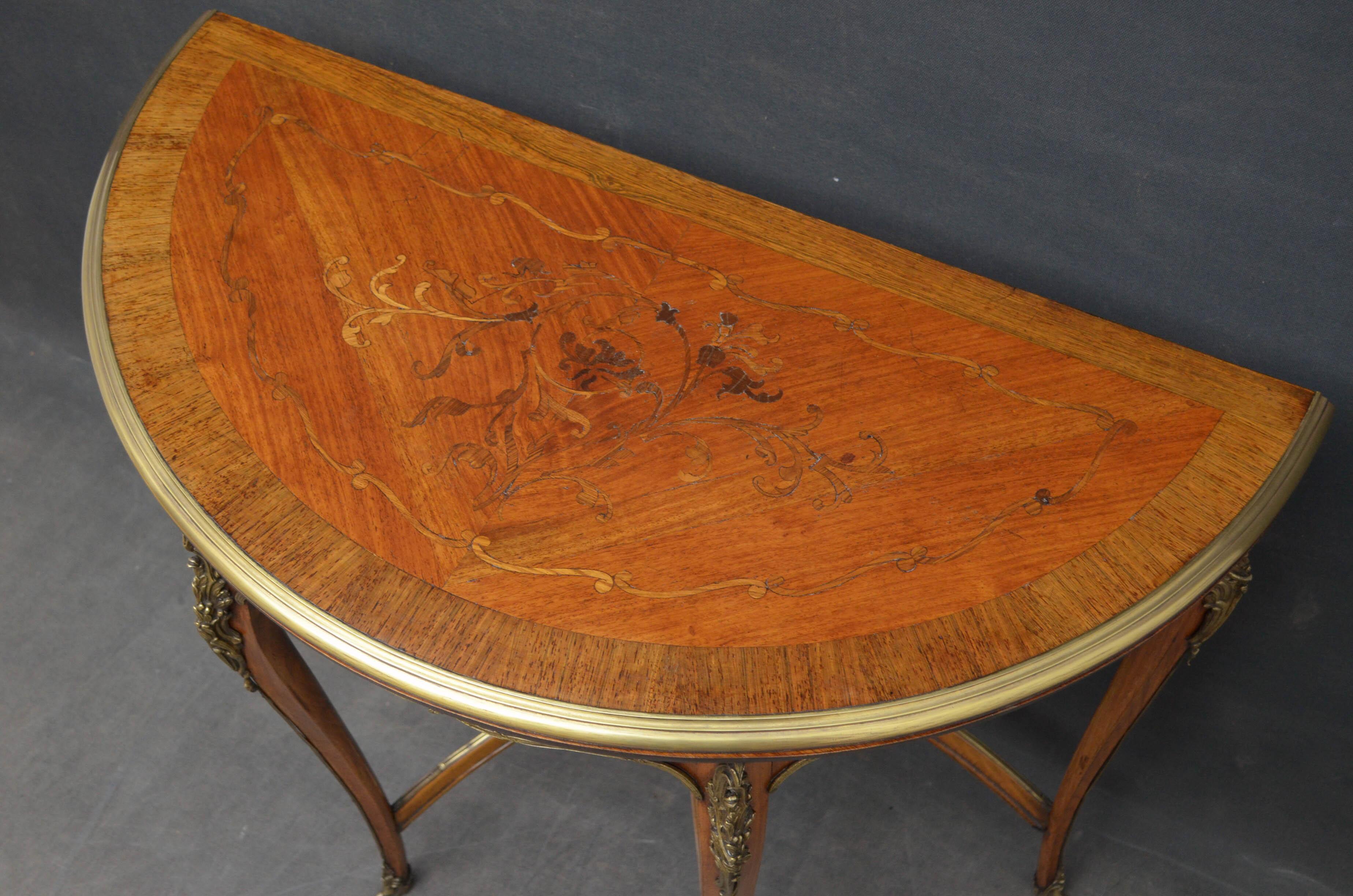 Sn4690 Attractive French demi lune card table, having finely inlaid top with brass edge, top opens to reveal maroon baize playing surface, inlaid frieze and 4 cabriole legs with ormolu decoration, all united by shaped stretcher. This antique card