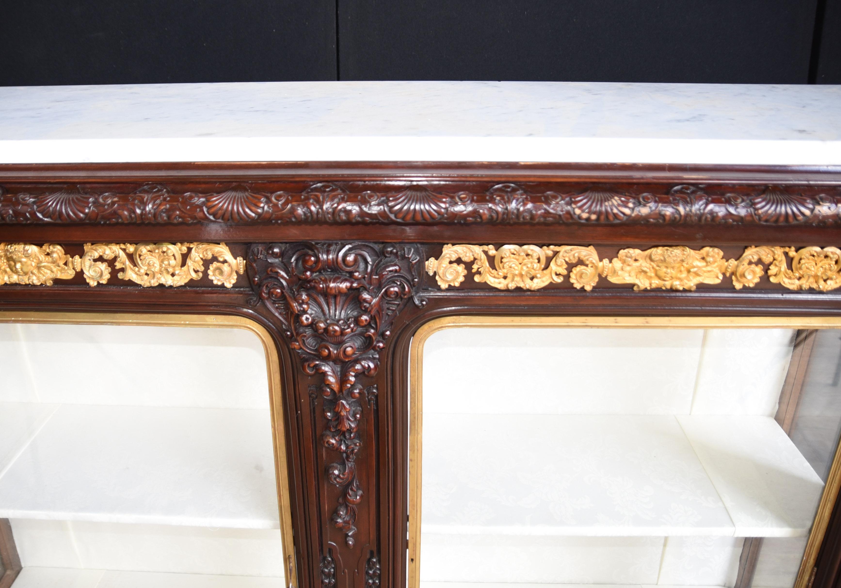 - Stunning French double fronted sideboard / display cabinet
- Highest quality with hand carved details in rosewood
- Ormolu fixtures incredibly detailed and intricate
- Purchased from a dealer on Marche Biron at Paris antiques markets
- White