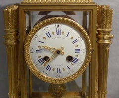 French rouge marble and ormolu four glass clock signed Raingo Freres