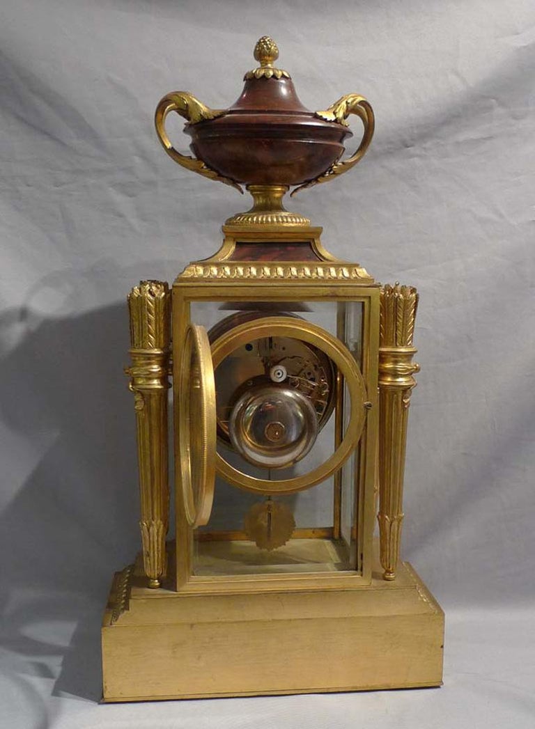 Late 19th Century French rouge marble and ormolu four glass clock signed Raingo Freres For Sale