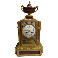 French rouge marble and ormolu four glass clock signed Raingo Freres