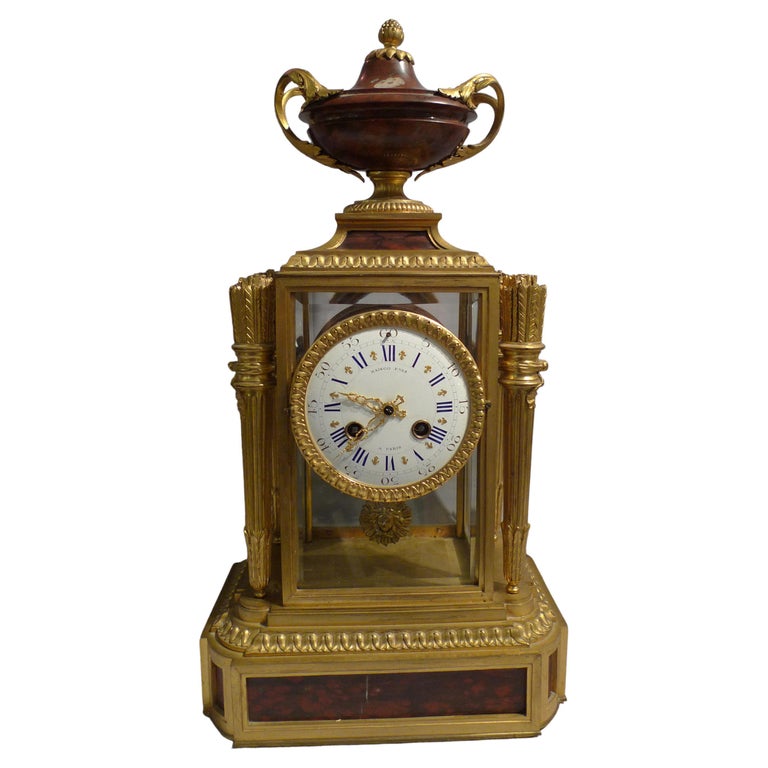 French rouge marble and ormolu four glass clock signed Raingo Freres For Sale