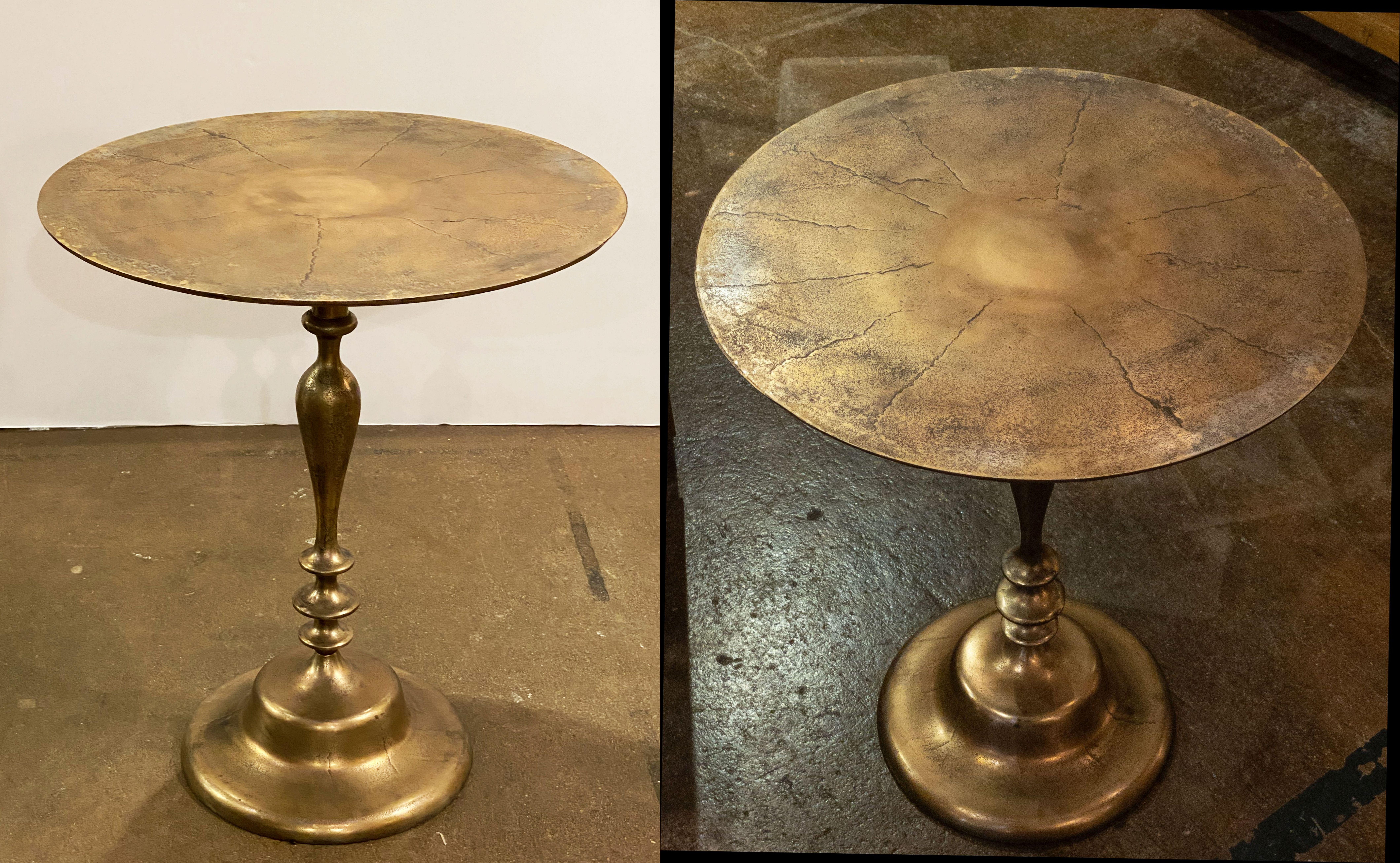 A fine French round or circular top occasional or bistro table of cast aluminum, featuring a round top mounted to a stylish column base.
Marked on underside of table: Ritz Hotel - Paris.

Dimensions: Height 23 1/2 inches x diameter 20 1/4