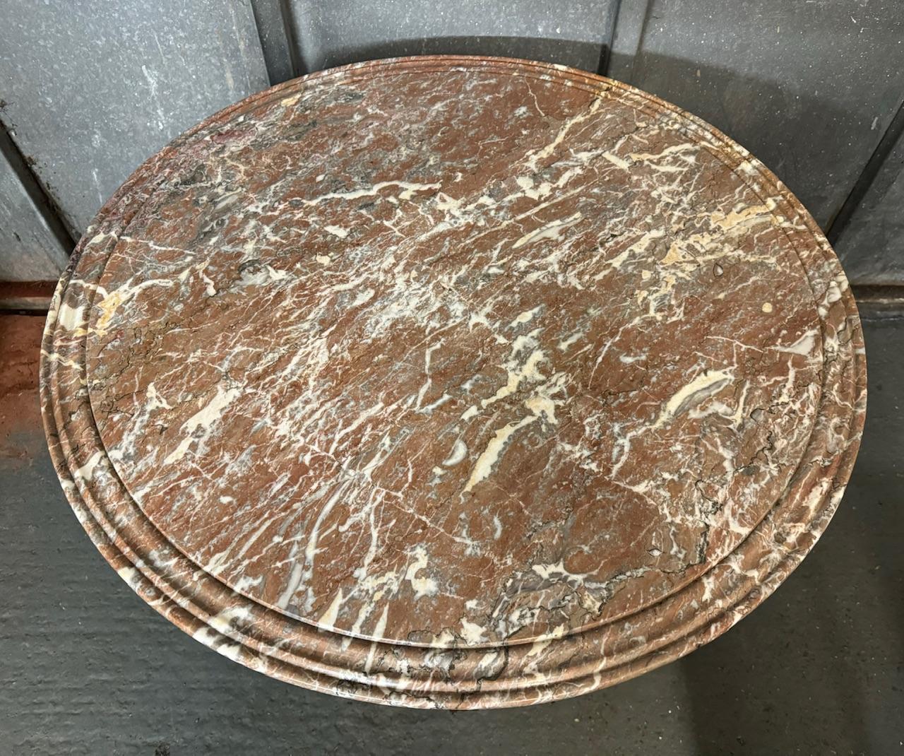 A good quality French Round Gueridon Centre Table. Dating to the early 19th Century the base is mahogany and the original variegated marble top has decorative grooves towards the edge. 
In excellent original condition for the home.
Diameter 99