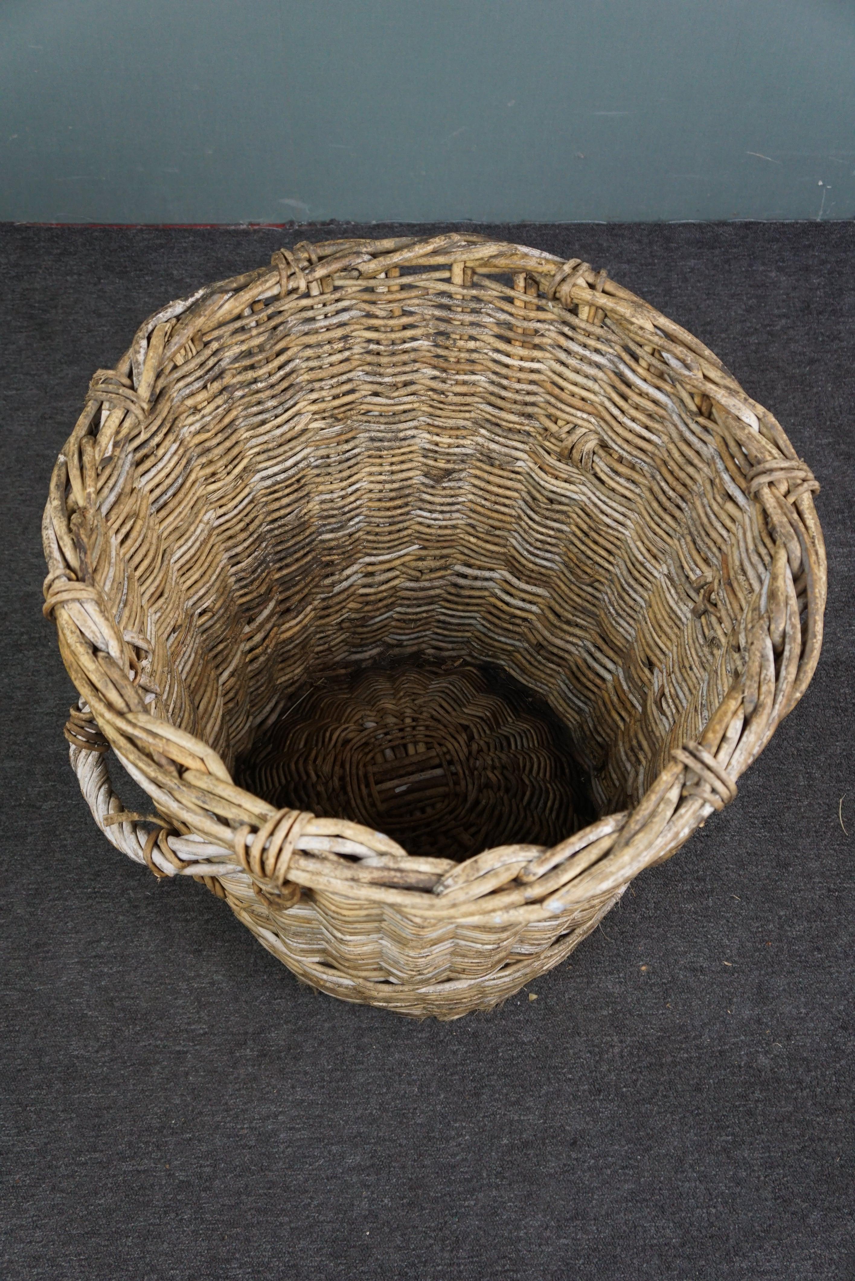 Offered is this large wicker basket for wooden blocks.
Next to a crackling fire we place a hand-woven wicker basket that fits many logs. This large basket is handy and also looks great next to the fireplace. Due to age, this basket has a beautiful