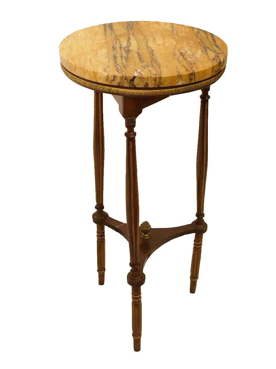 French round marble top table, with beautiful sienna marble top( removable) on a wood base surrounded by a gilt brass decorative band; turned and reeded legs with brass rings and brass appliques in the reeding; concave platform stretcher with gilded