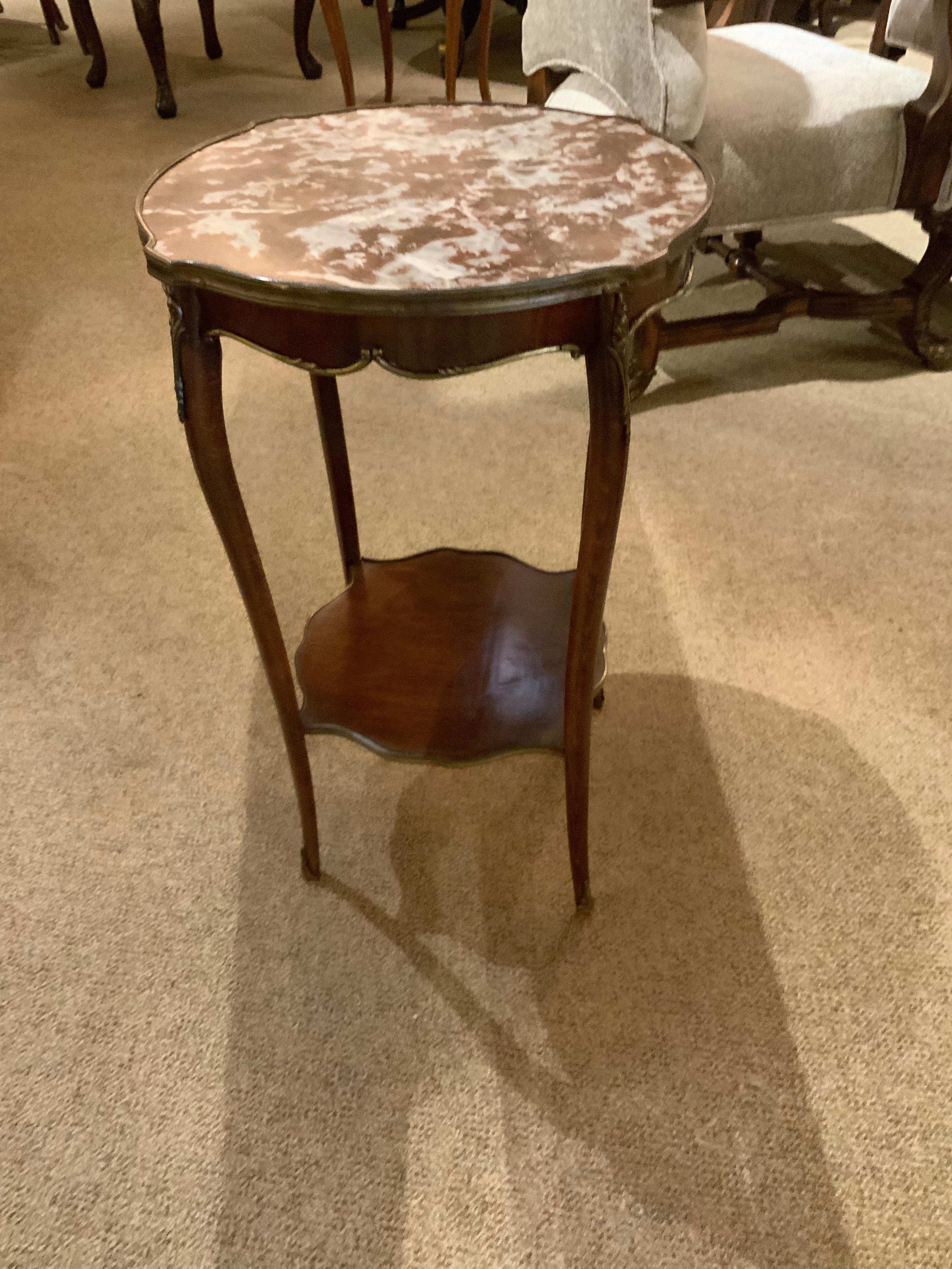 Fine round louis XV style occasional table w its rouge marble.
Exquisite detail bronze work.