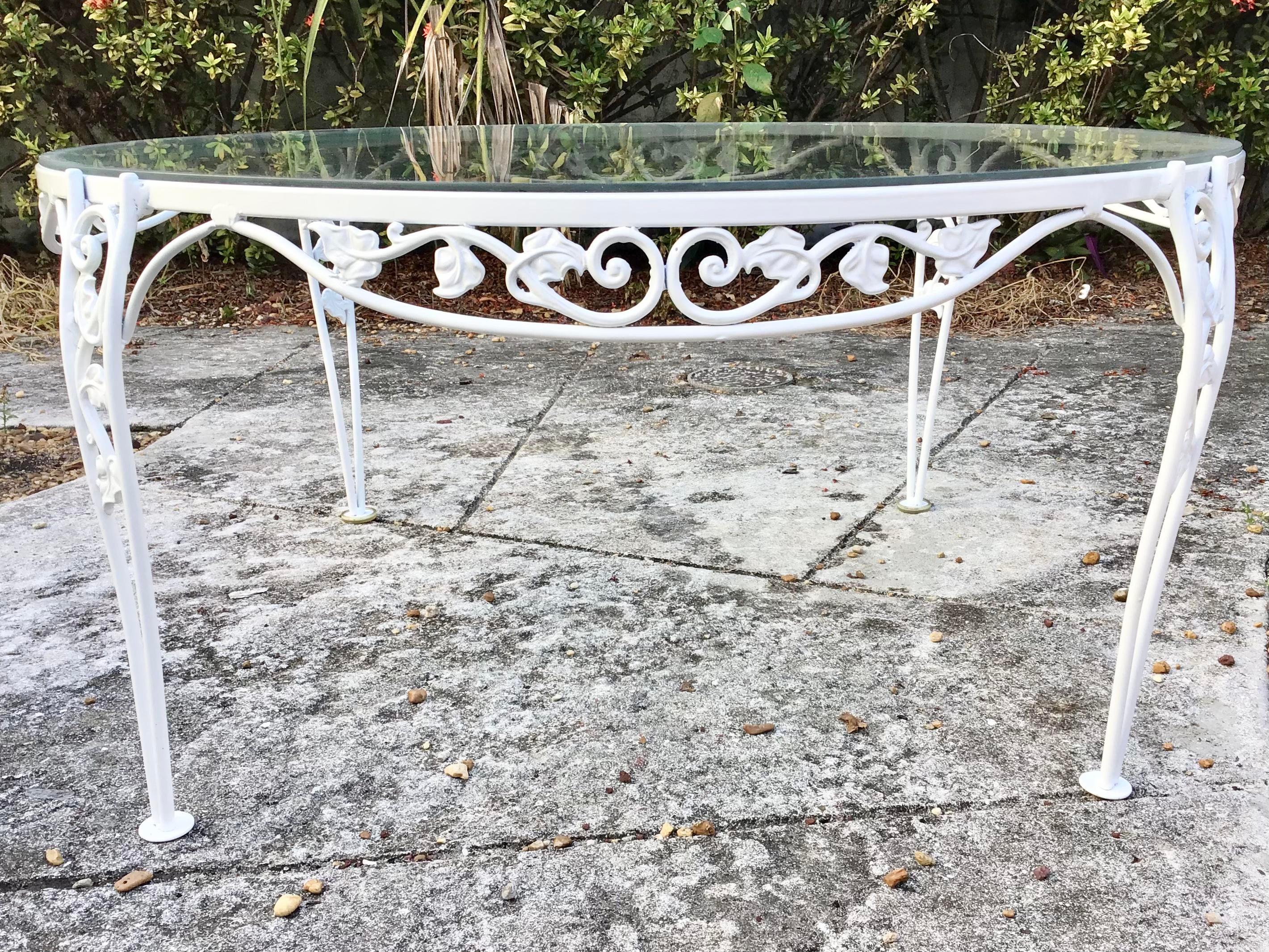 Beautiful French round patio aluminum coffee table in new white lacquer with a glass top. Add some elegant character to your patio.