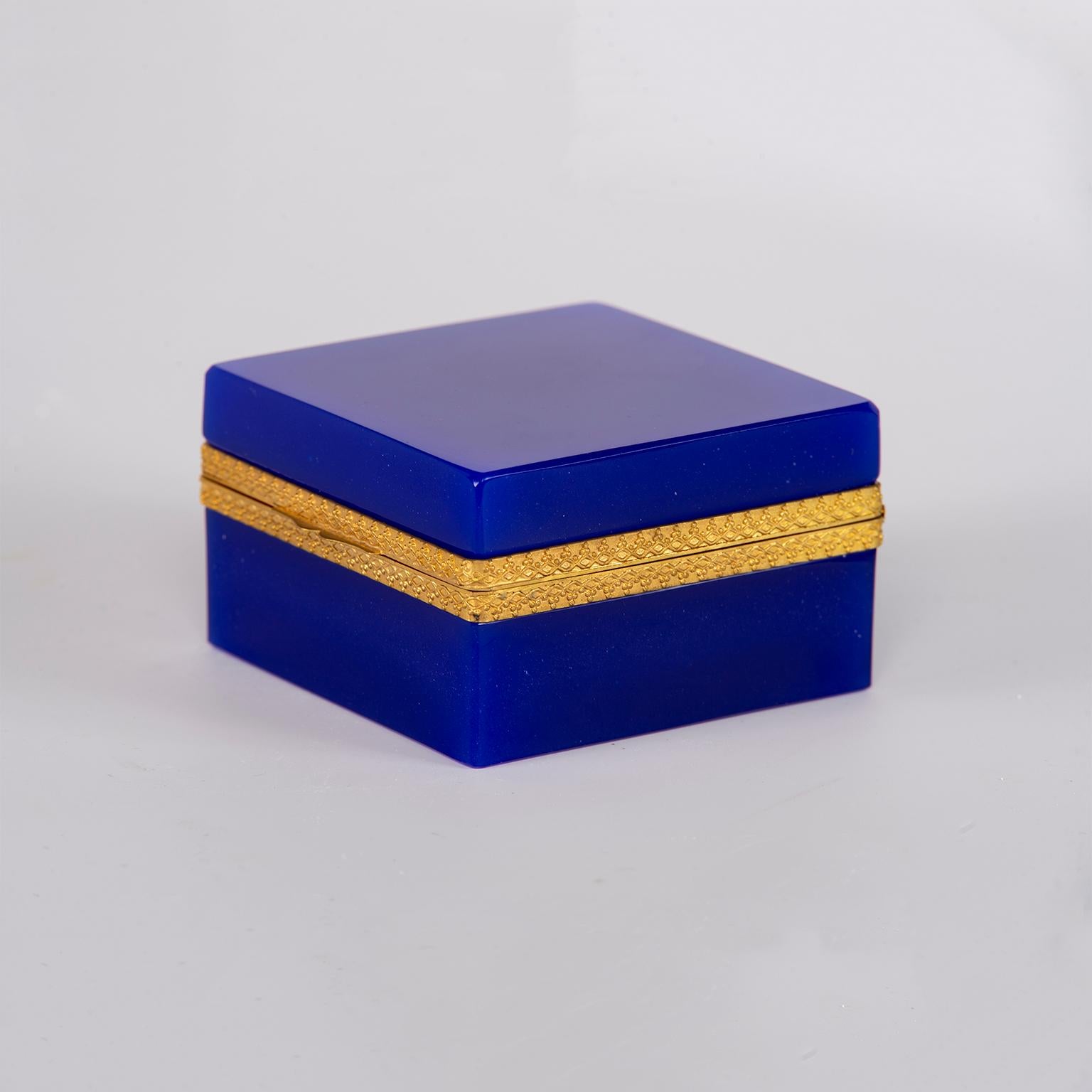 Square French opaline glass box with hinged lid in striking royal blue with polished brass mounts, circa 1920s. Unknown maker.