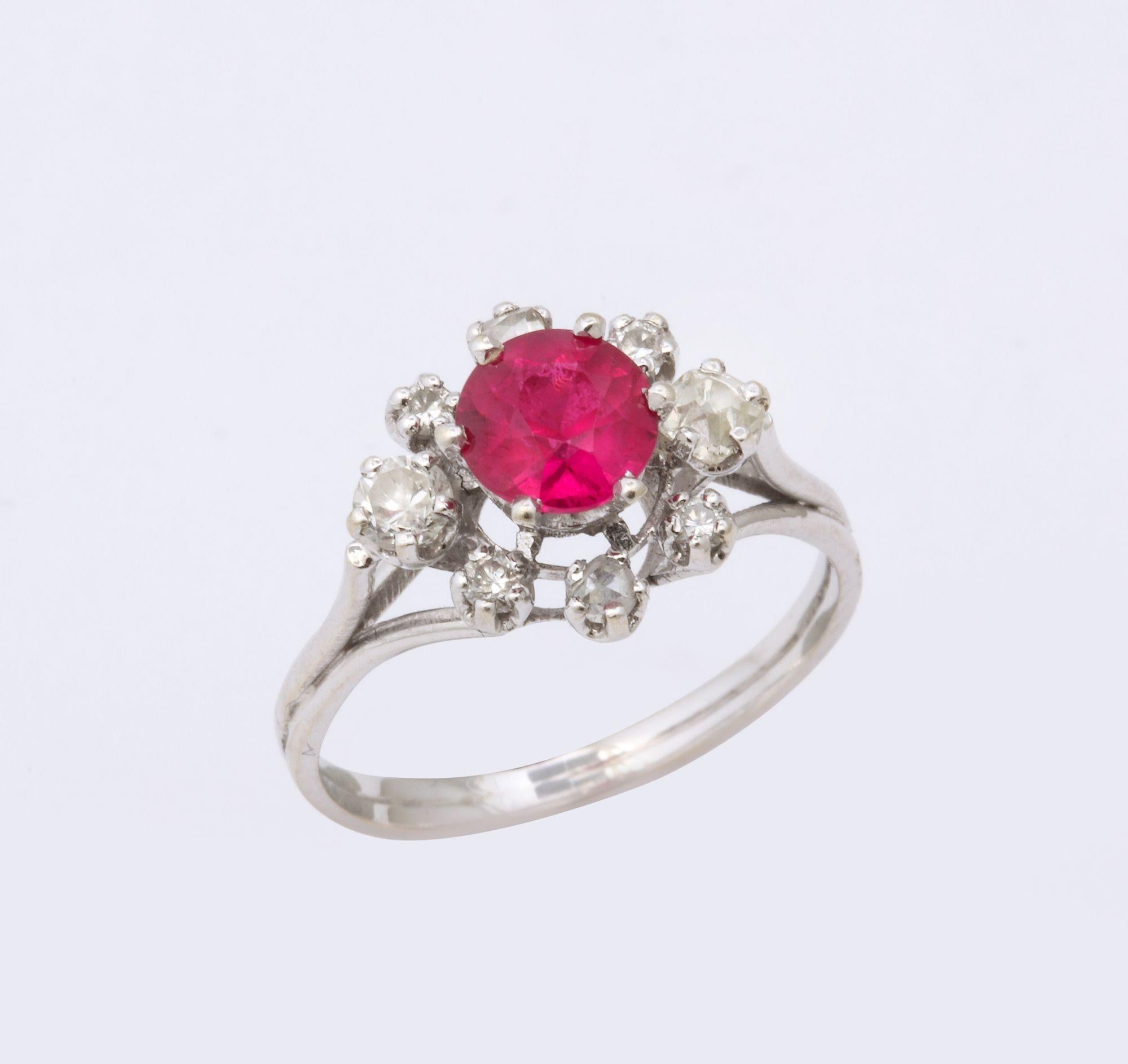 French Ruby (possibly synthetic) and Diamond Platinum Ring. Classic cluster ring with mine cut diamonds.