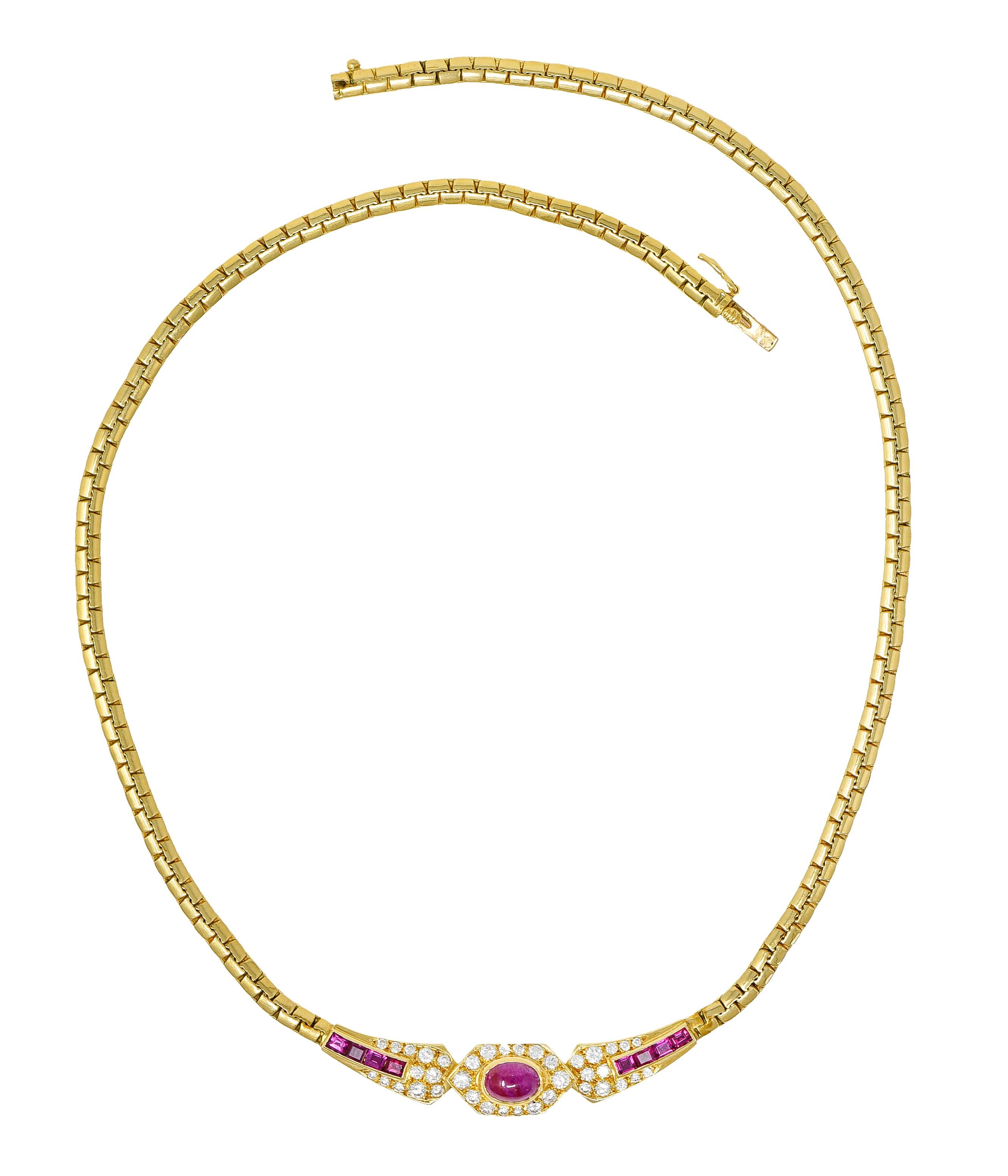 Collar necklace is comprised of brightly polished brick link chain

With a geometric central station

Featuring on oval cut ruby cabochon flanked by channel set rectangular cut rubies

Transparent to translucent slightly purplish red in color while