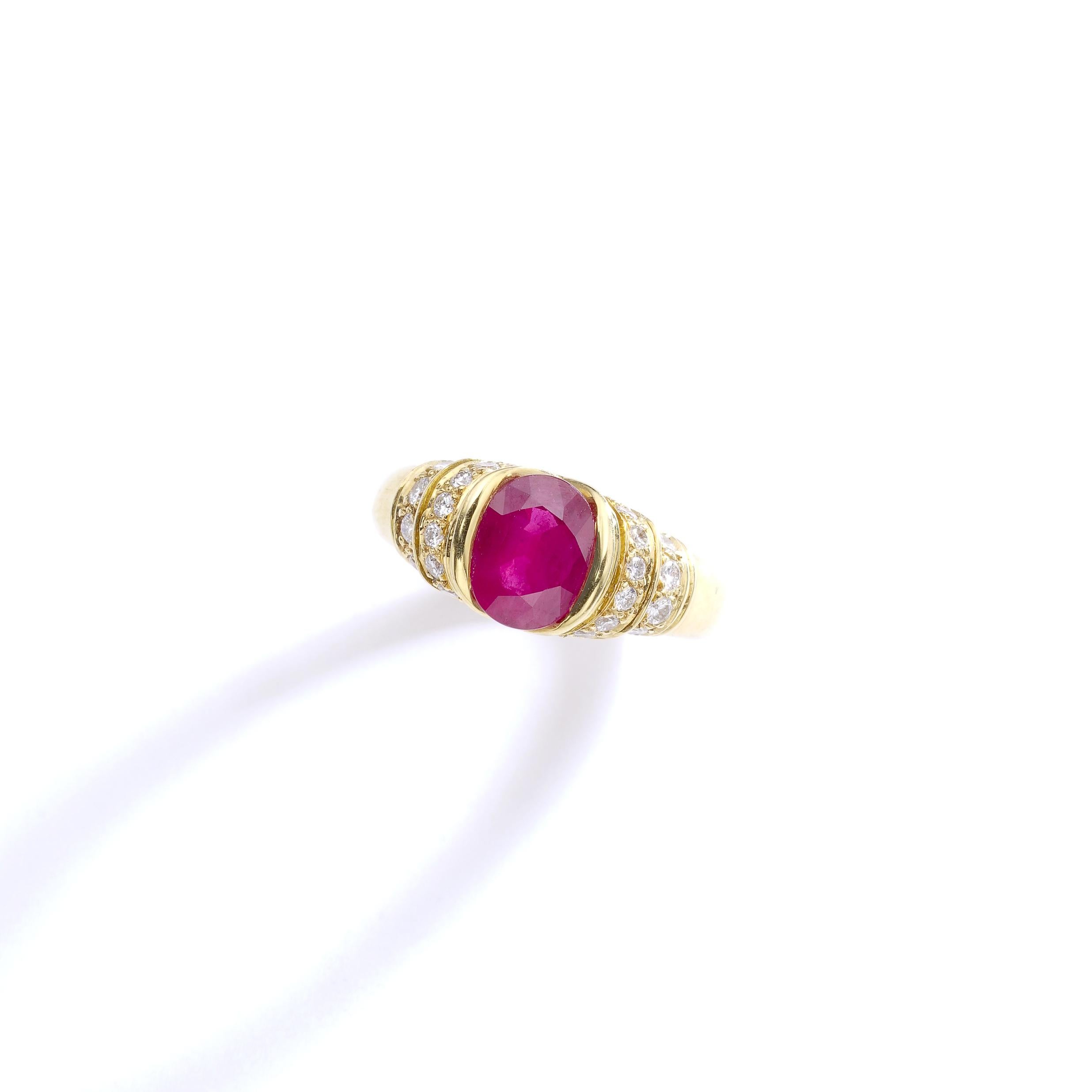 Late 20th Century's design this lovely Oval Ruby centers a yellow gold 18k 750 ring surrounded by diamond. Red and Yellow colors are perfectly matching.
French marks. 
Ring size: 6 US.