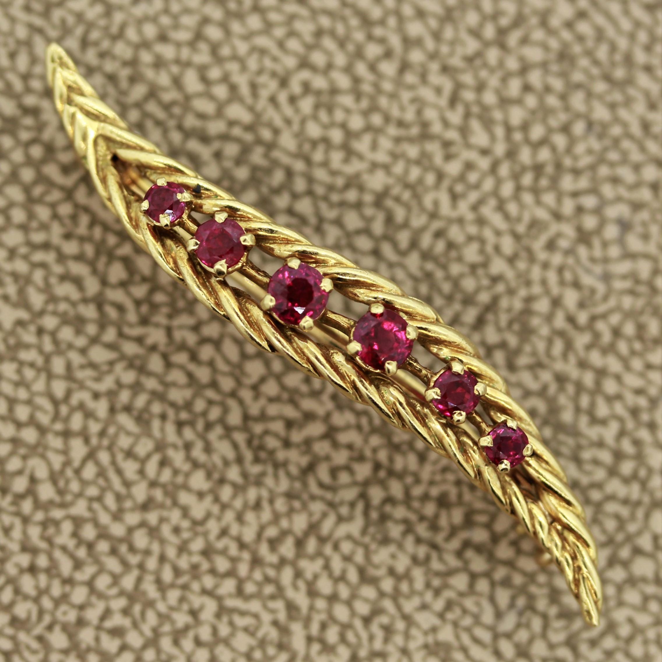 A simple yet elegant pin made in France. It features 6 superb gem quality round cut rubies with a vivid blood red color. It is set in 18k yellow gold and hand made with the quality one associates with French jewelers.

Length: 1.5 inches