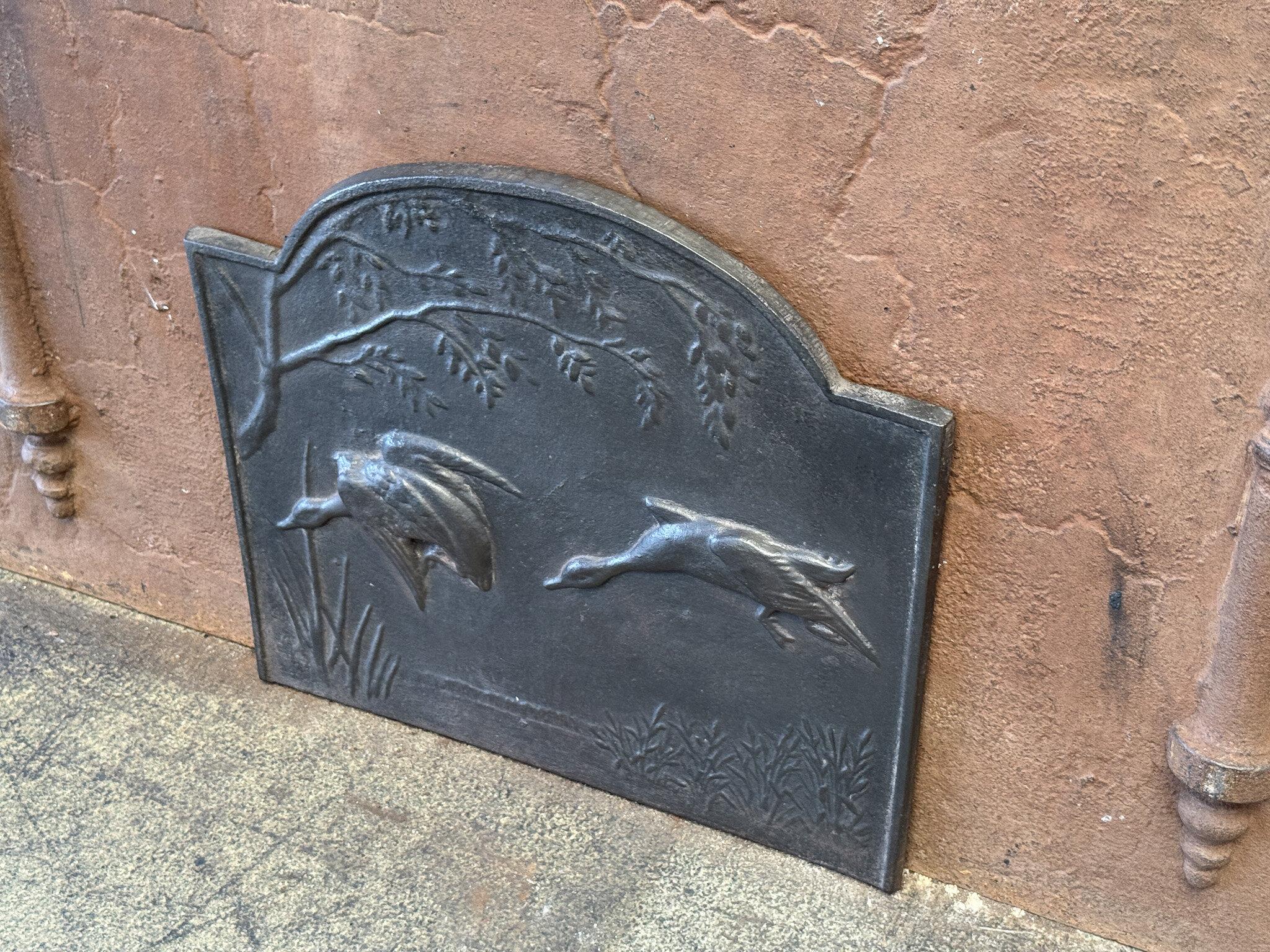 20th Century French fireback with a rural scene. The style of the fireback is Art Nouveau Style, 20th Century.

The fireback is made of cast iron and has a black / pewter color. The condition is good, it does not have cracks.