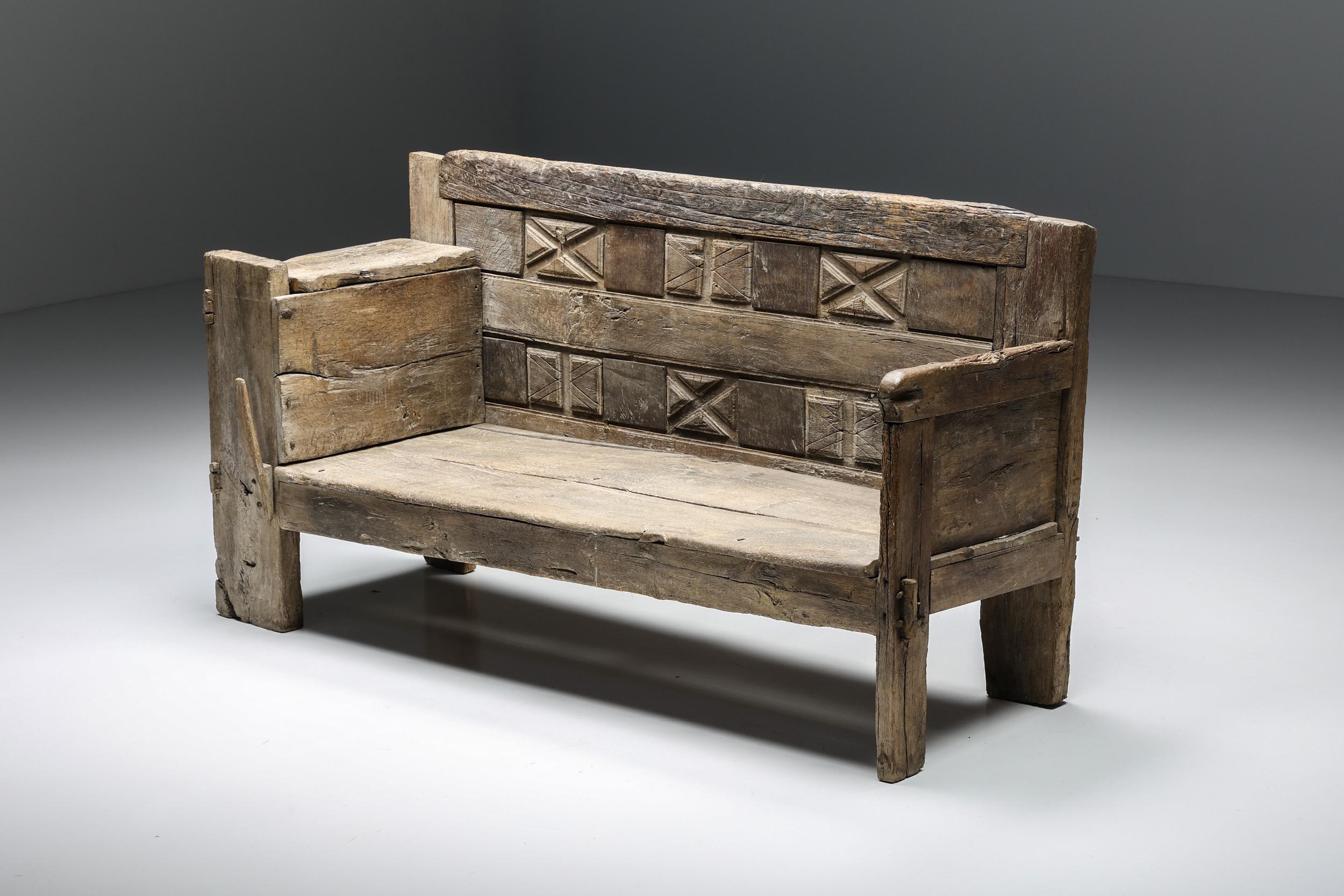 French Craftsmanship; Rustic; Wood; Bench; Seating Element; Sofa; Hand-Made; One-Of-A-Kind; Hand-Carved; France; 1800s; Patina; 19th Century; 

Rustic wooden bench with remarkable hand-carved details in the backrest and armrests. This piece is a