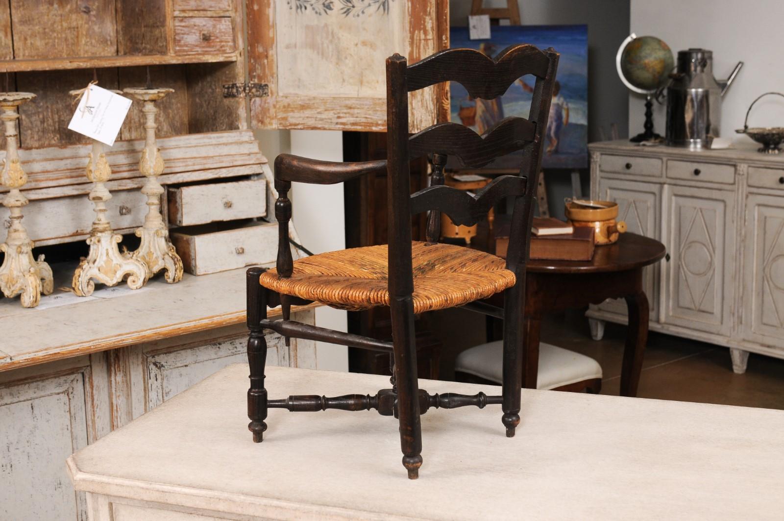 French Rustic Dark Oak 19th Century Child's Chair with Ladder Back and Rush Seat For Sale 6