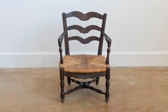French Rustic Dark Oak 19th Century Child's Chair with Ladder Back and Rush Seat