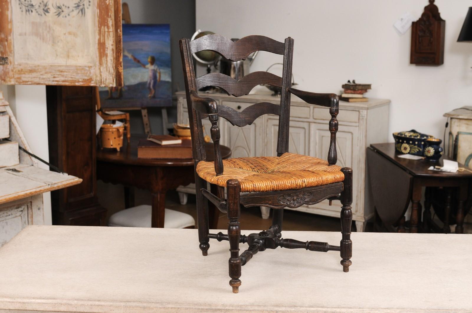 French Rustic Dark Oak 19th Century Child's Chair with Ladder Back and Rush Seat In Good Condition For Sale In Atlanta, GA