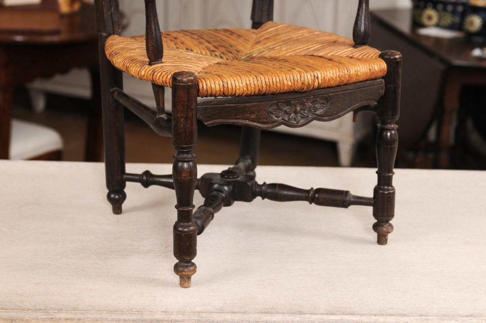 French Rustic Dark Oak 19th Century Child's Chair with Ladder Back and Rush Seat For Sale 1