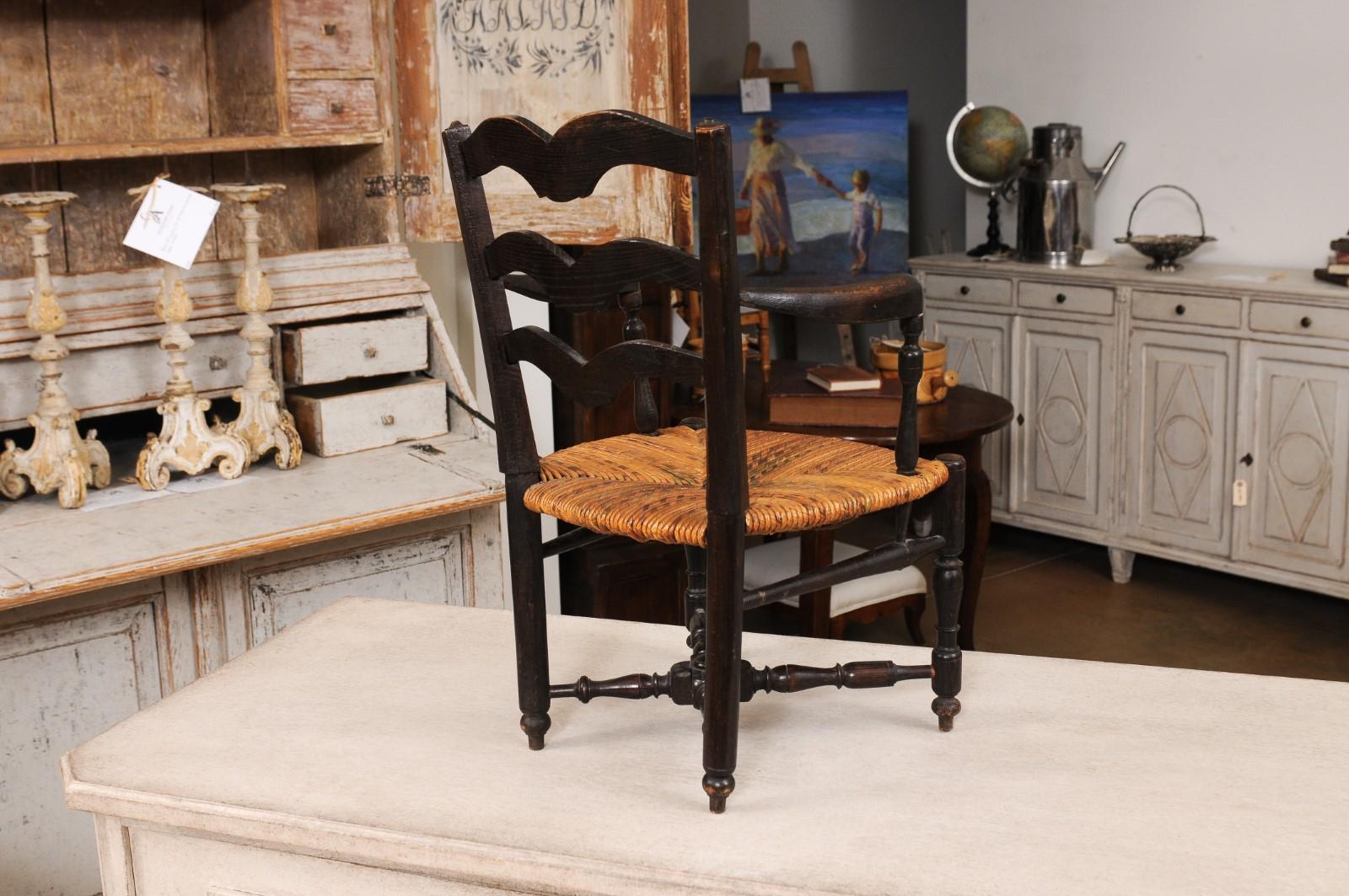 French Rustic Dark Oak 19th Century Child's Chair with Ladder Back and Rush Seat For Sale 4
