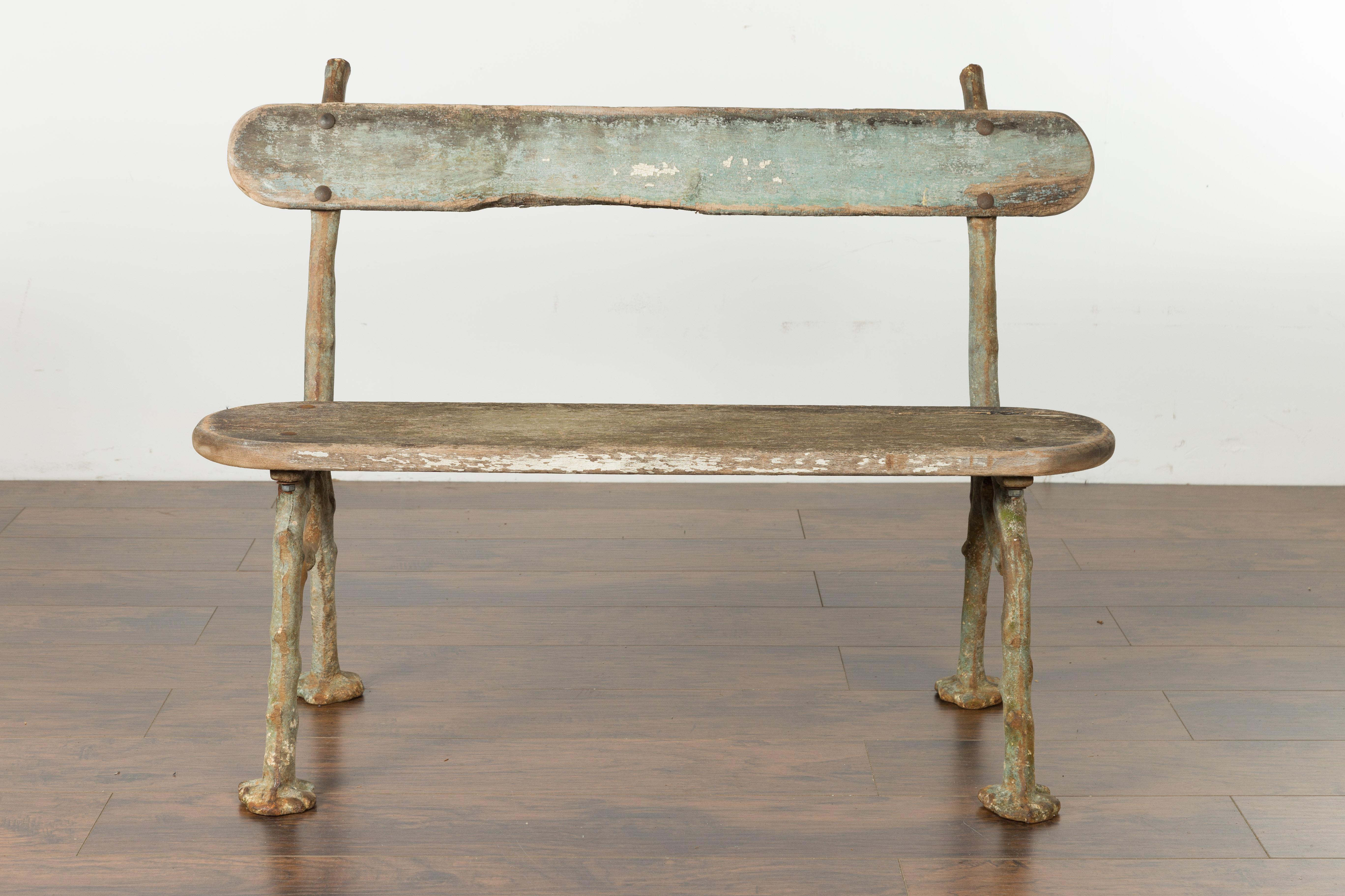 A French rustic faux-bois iron garden bench from the late 19th century. Particularly popular in France during the later years of the 19th century through the 1940s, the faux bois technique (translating as false wood) allowed artists to use various