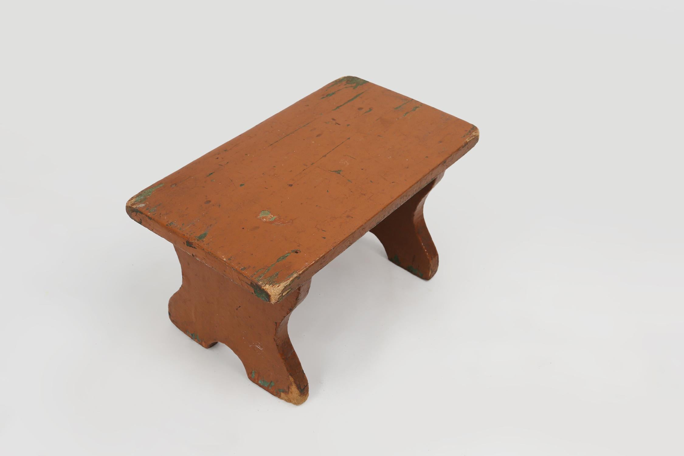 Wood French rustic low church stool in terracotta painted wood, ca. 1900 For Sale