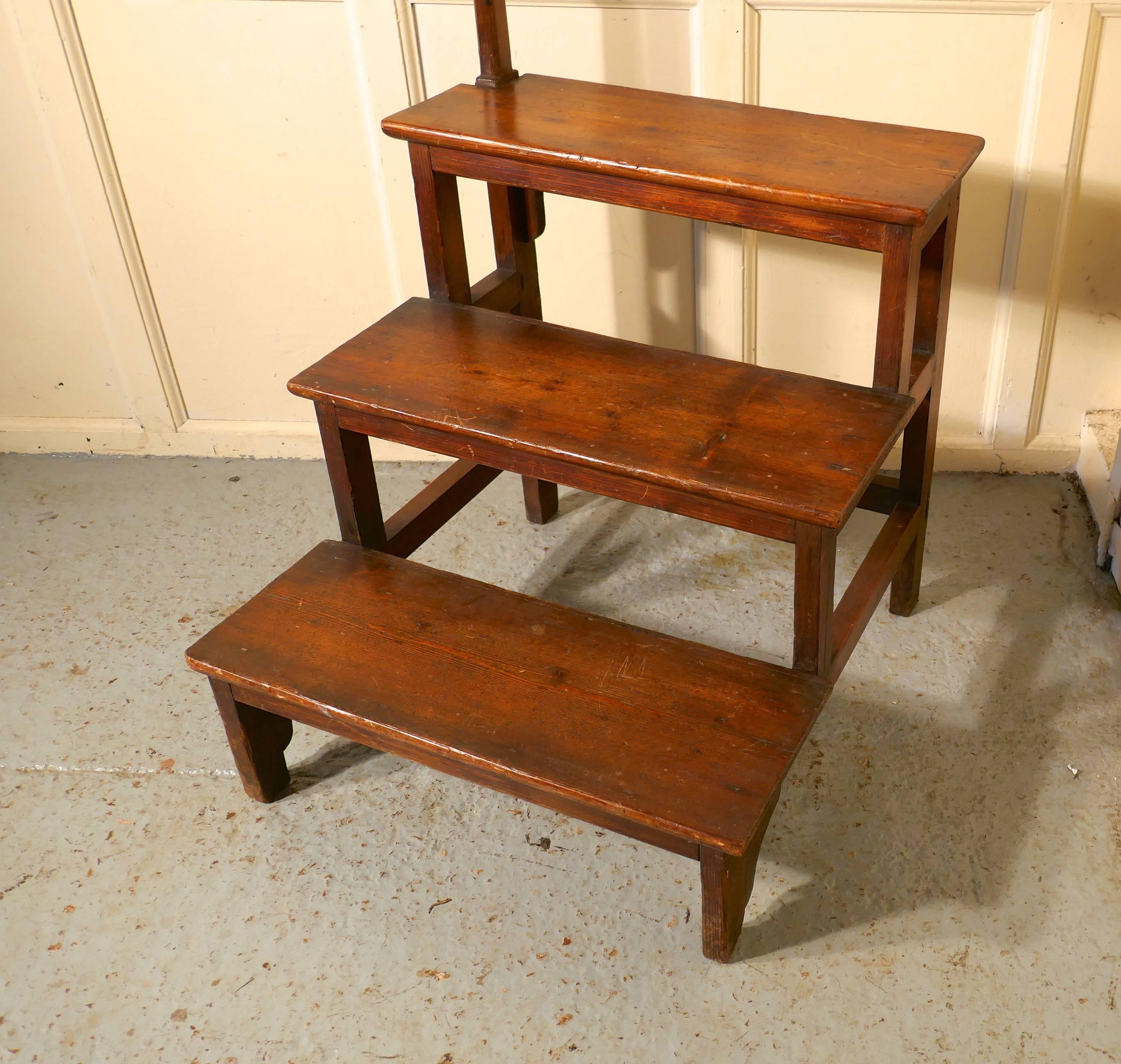 French rustic pine shop steps

This charming set of steps come from France, they came from a French shop where they were used to reach the high shelves, they are very sturdy, a bit rustic looking, they are in the original dark finish pine
The