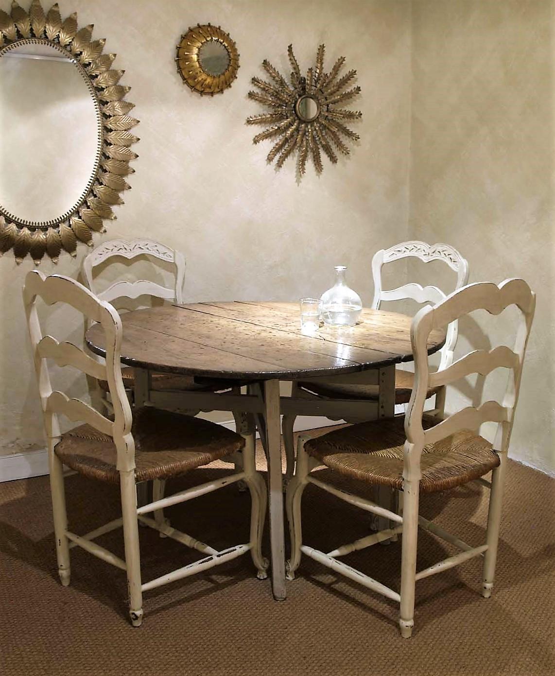 A 19th century French chestnut wood vineyard table with round top and patinated folding X-legs.
The round top is thick, heavy and strong. The top has a terrific aged patina showing marks from the pass of years and beautiful wood veins. The top