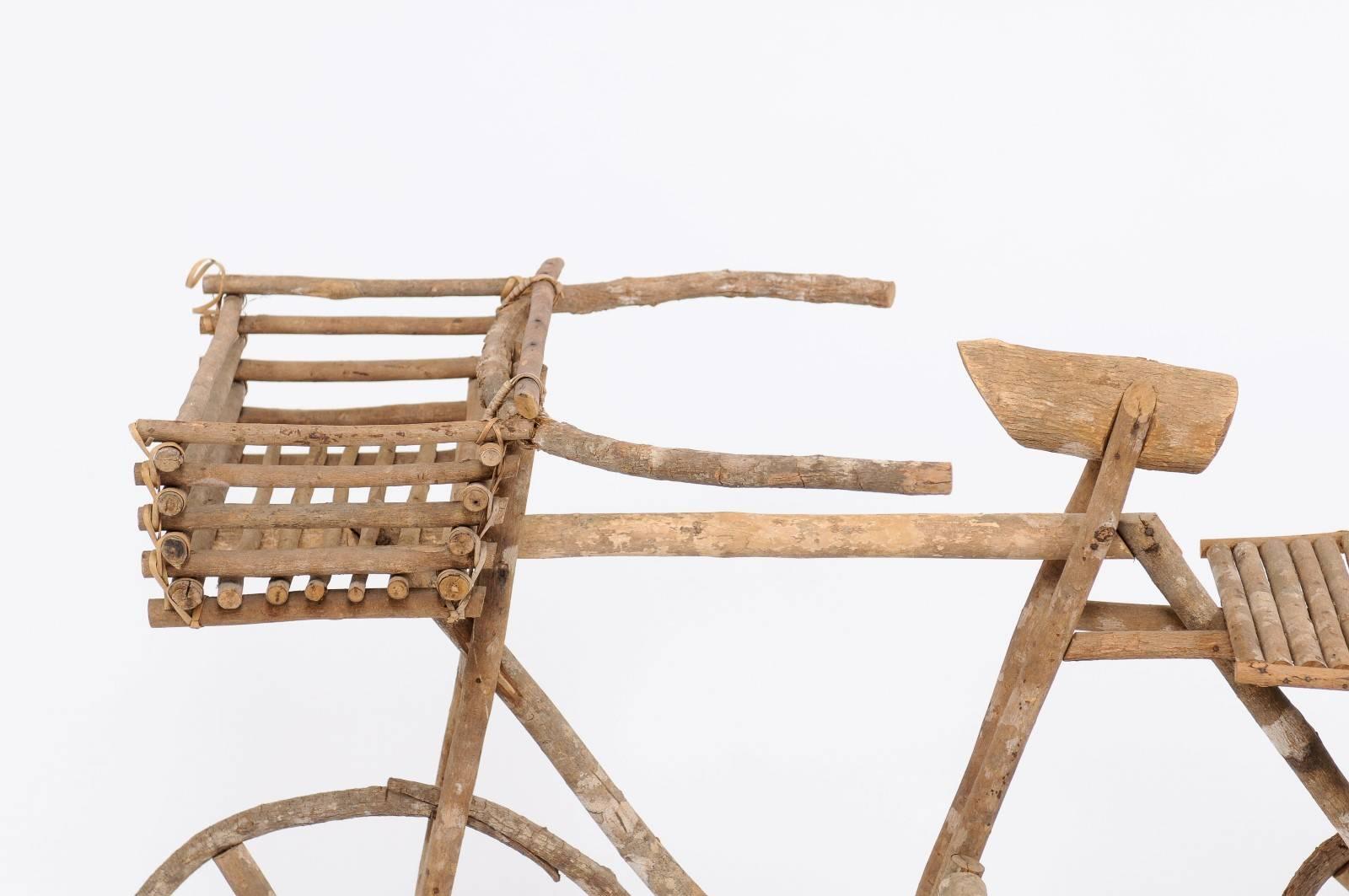 A rustic French wooden bicycle decorative accent from the 1970s, perfect to be used as a garden ornament or planter. This put a big smile on our faces the minute we spotted it at a fair in the south of France. What’s not to love? A sassy,
