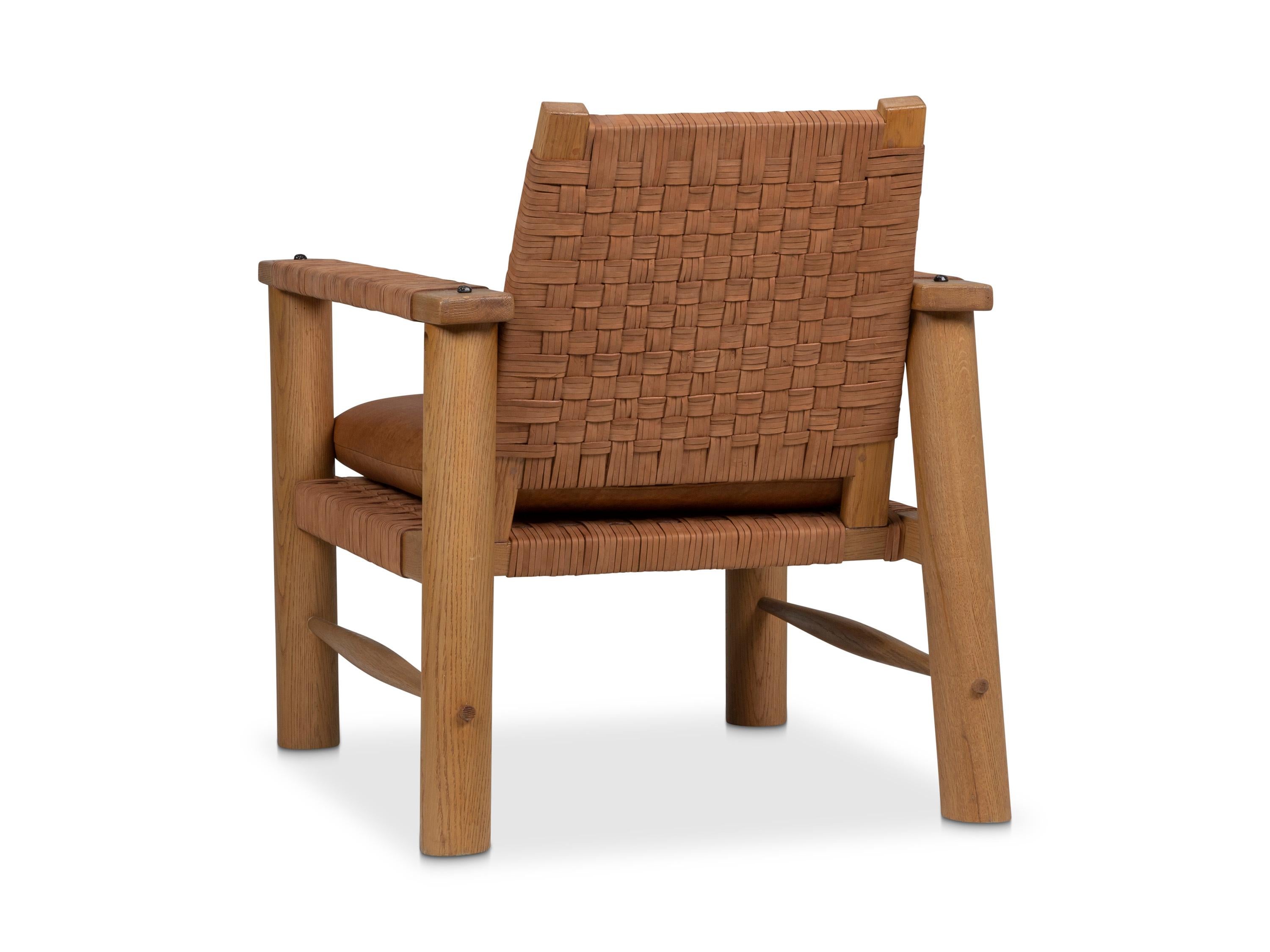 Boldly scaled vintage French rustic lounge chair given a contemporary urban vibe with woven rough out suede seat, back, and arm panels. Sturdy, large turn legs and wide wood arms convey a masculine feel. Comes with a matching leather seat
