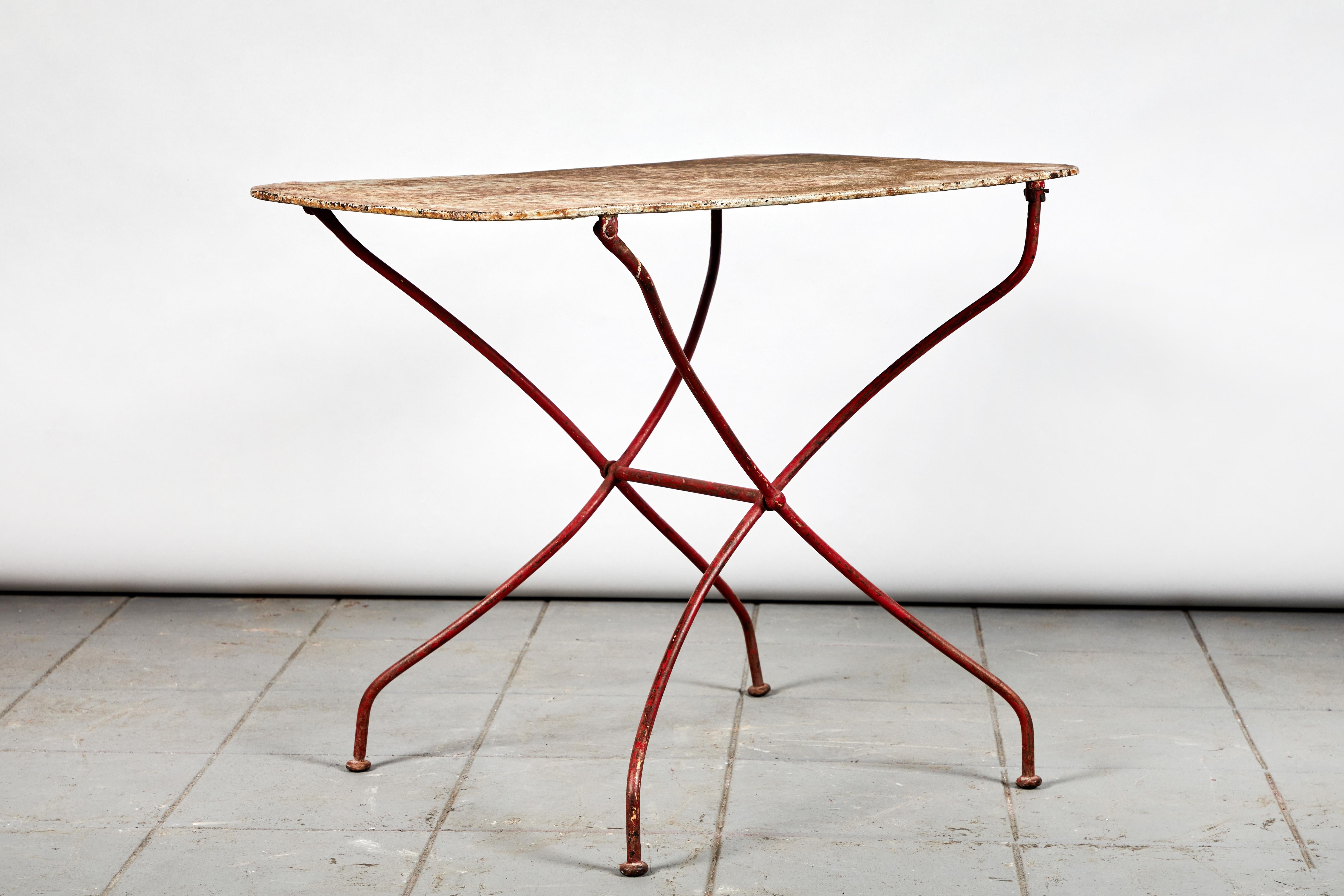 French rusty red table metal with lots of character and patina.