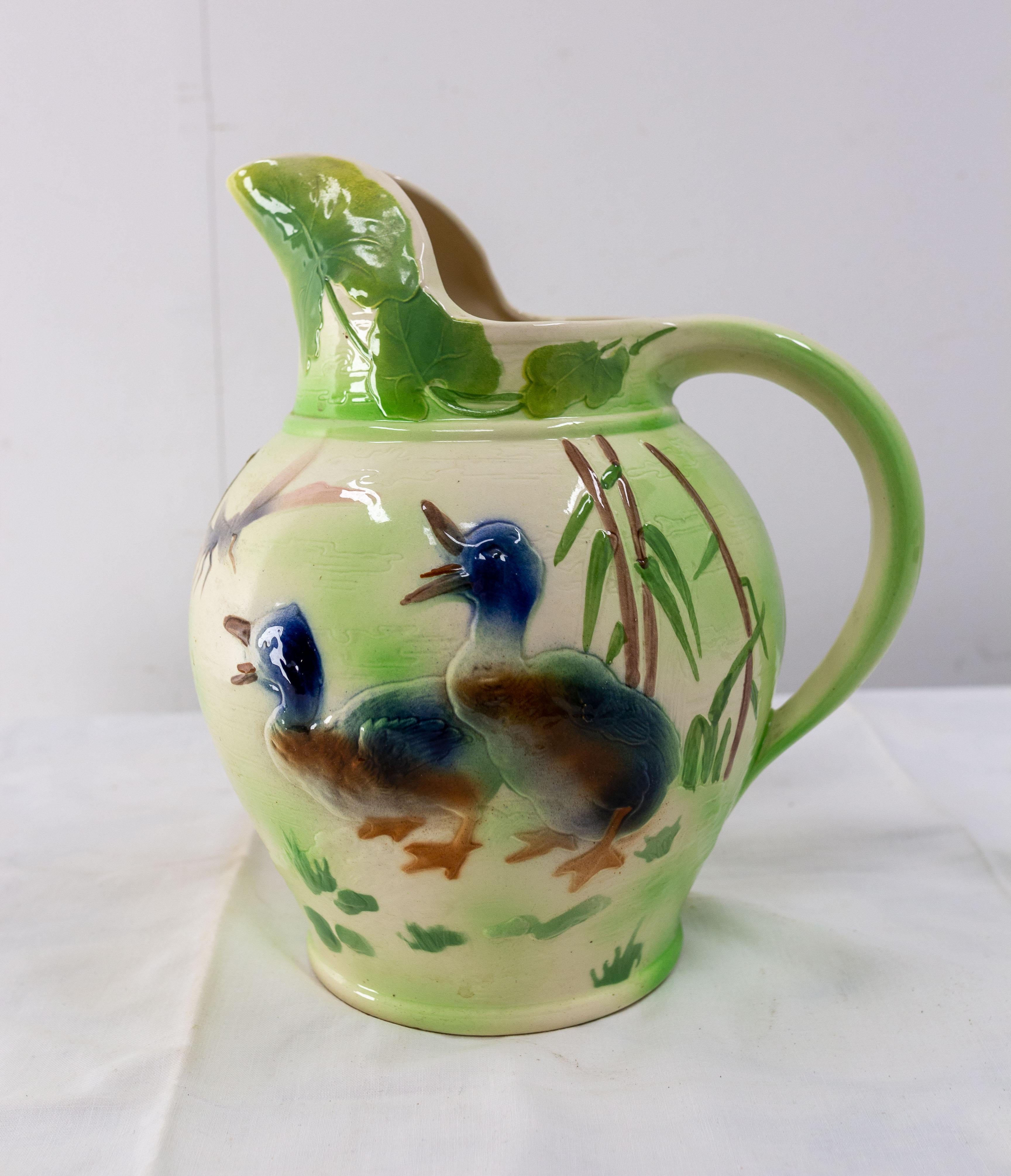 Faience Pitcher représenting two ducks in a vegetal decor.
Made circa 1960, in the 1900 style, France.
The Faincerie de Saint-Clément is the heiress of the prestigious faience of Lorraine since the eighteenth century. The Saint-Clément factory was