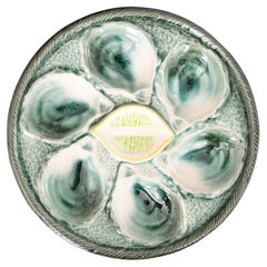 Piatto da ostriche francese Saint Clément in maiolica verde e gialla, c.C. 1930