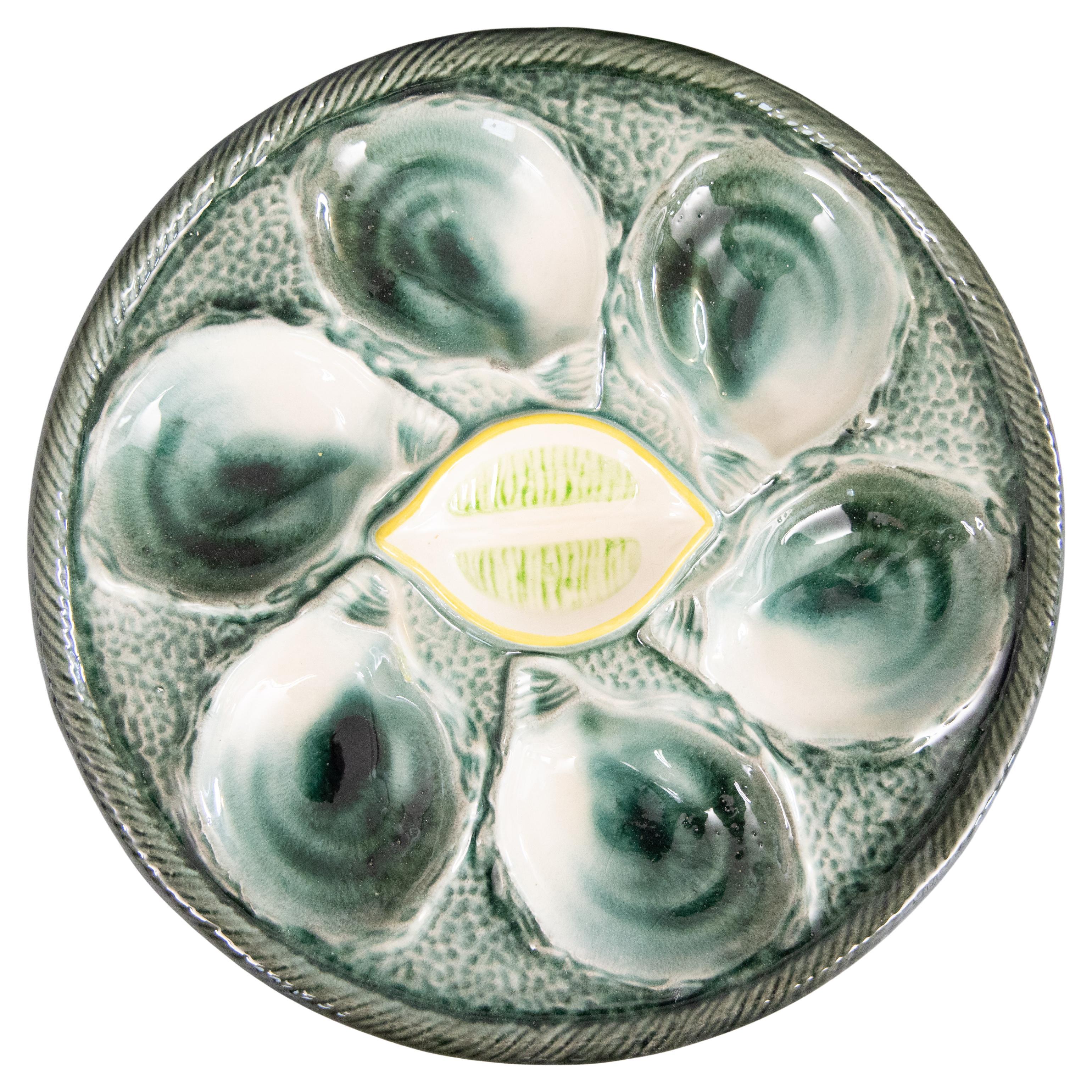 Piatto da ostriche francese Saint Clément in maiolica verde e gialla, c.C. 1930