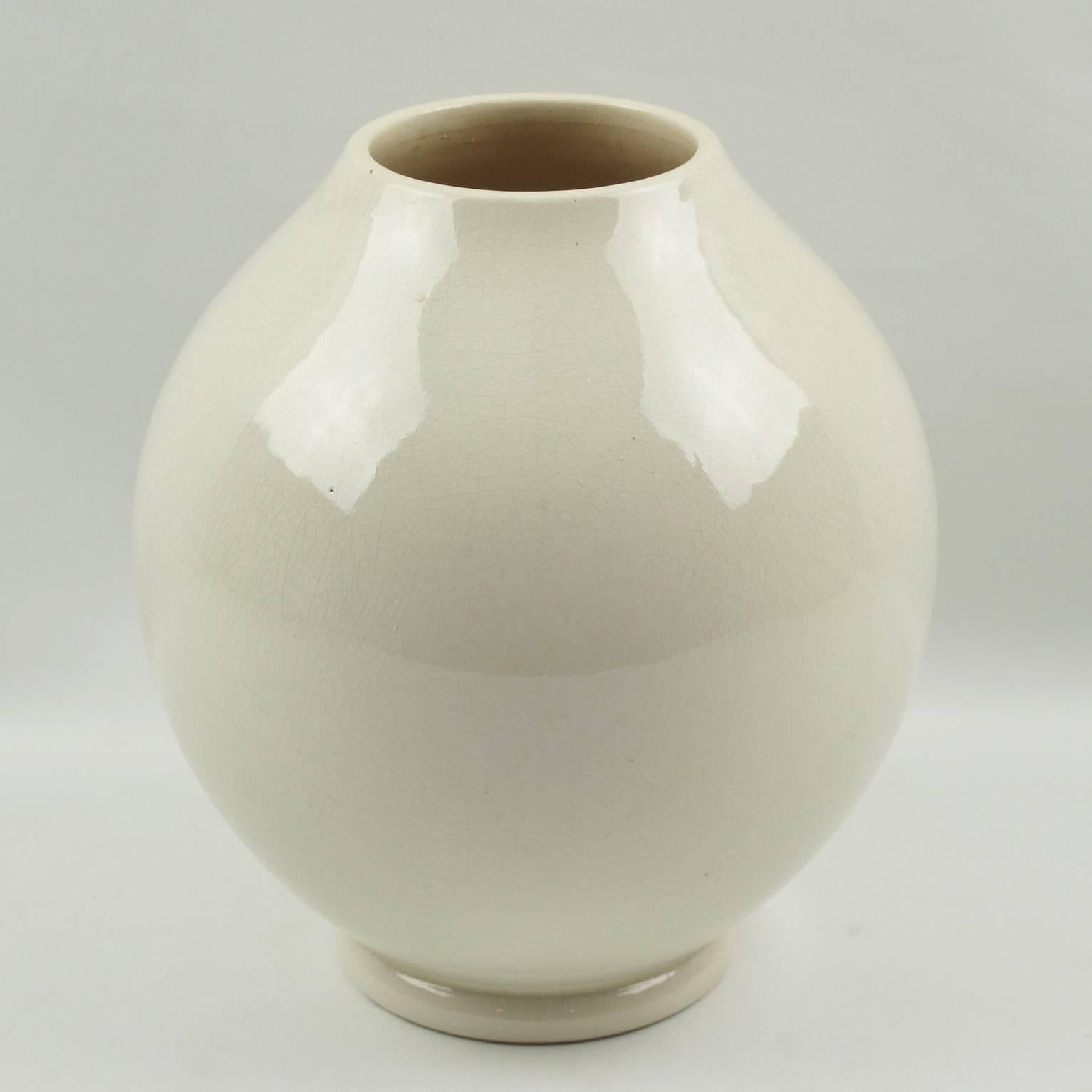 Modernist Art Deco vase by Saint-Clement, France with factory signature underside. French ceramic vase with white crackle glaze finish. Features a round streamline design with large collar opening. Embossed 