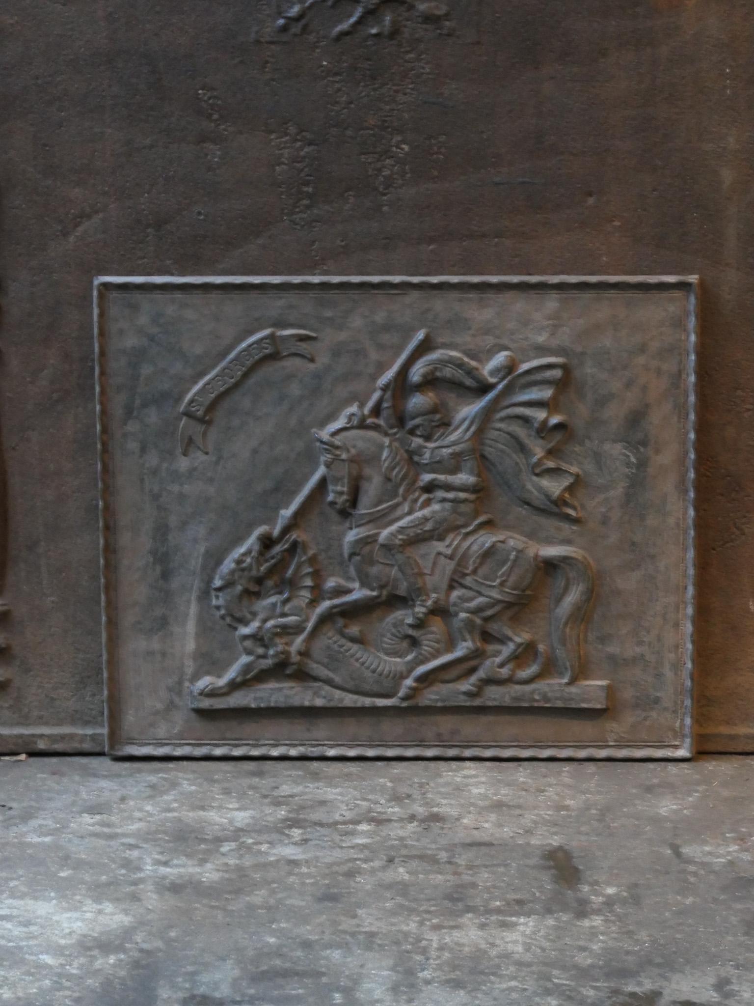 20th Century french fireback with Saint George defeating the dragon. 

The dragon is a symbol of paganism. Defeating the dragon symbolizes the conversion of a pagan country or city to Christianity. Richard Lionheart designated St George as patron of
