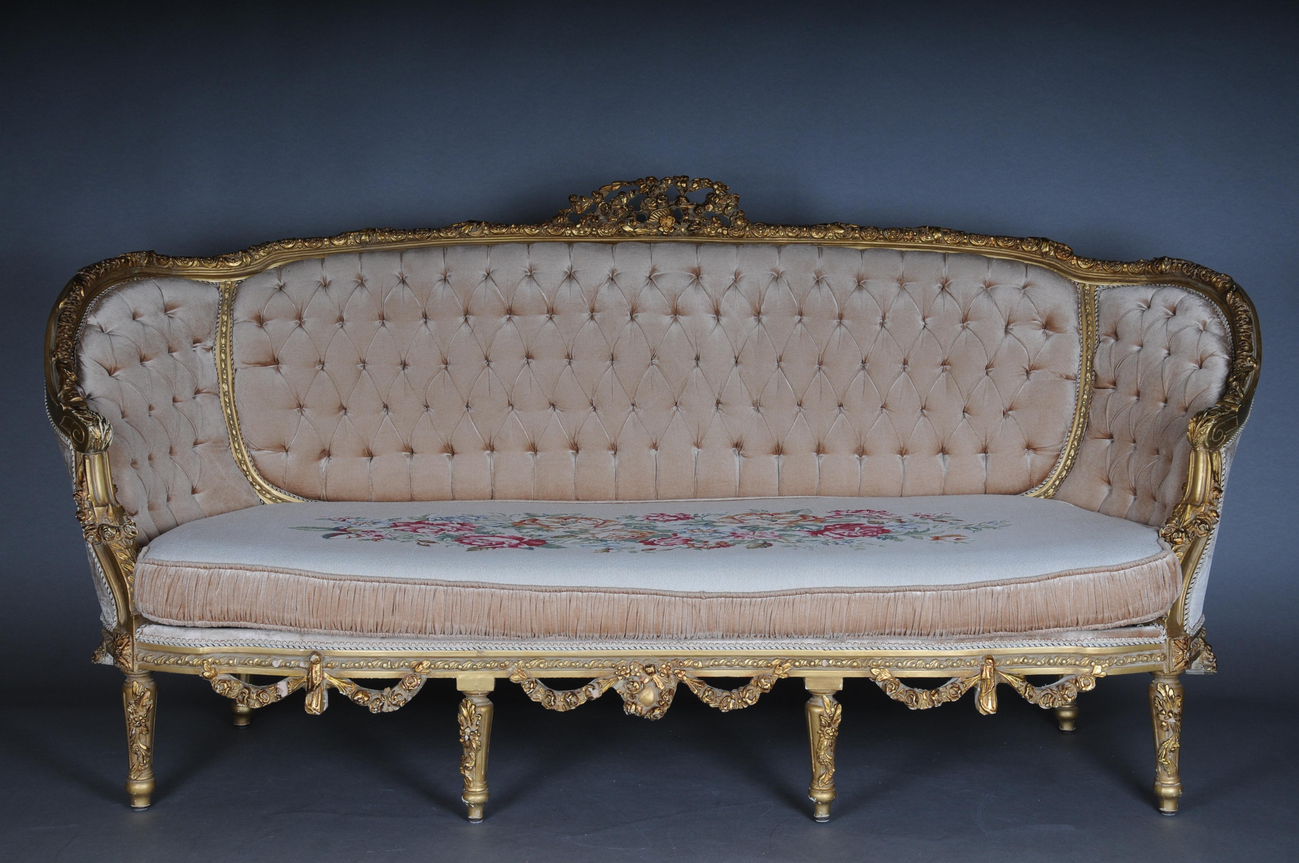 French salon seating Group Set Louis XVI Style, 20th Century gold

Solid beech wood, finely carved and set in gold. Slightly cambered and finely carved frame on curved legs. Curved armrests. Flanked by leaf rosettes in relief. Shield-shaped