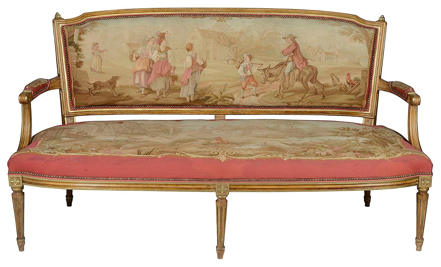 A good quality late 19th century French Louis XVI style salon suite, comprising of a sofa, a pair of arm chairs and four side chairs. Each having this wonderfully decorative Aubusson tapestry with a rich Pink ground, the backs and seats, depicting