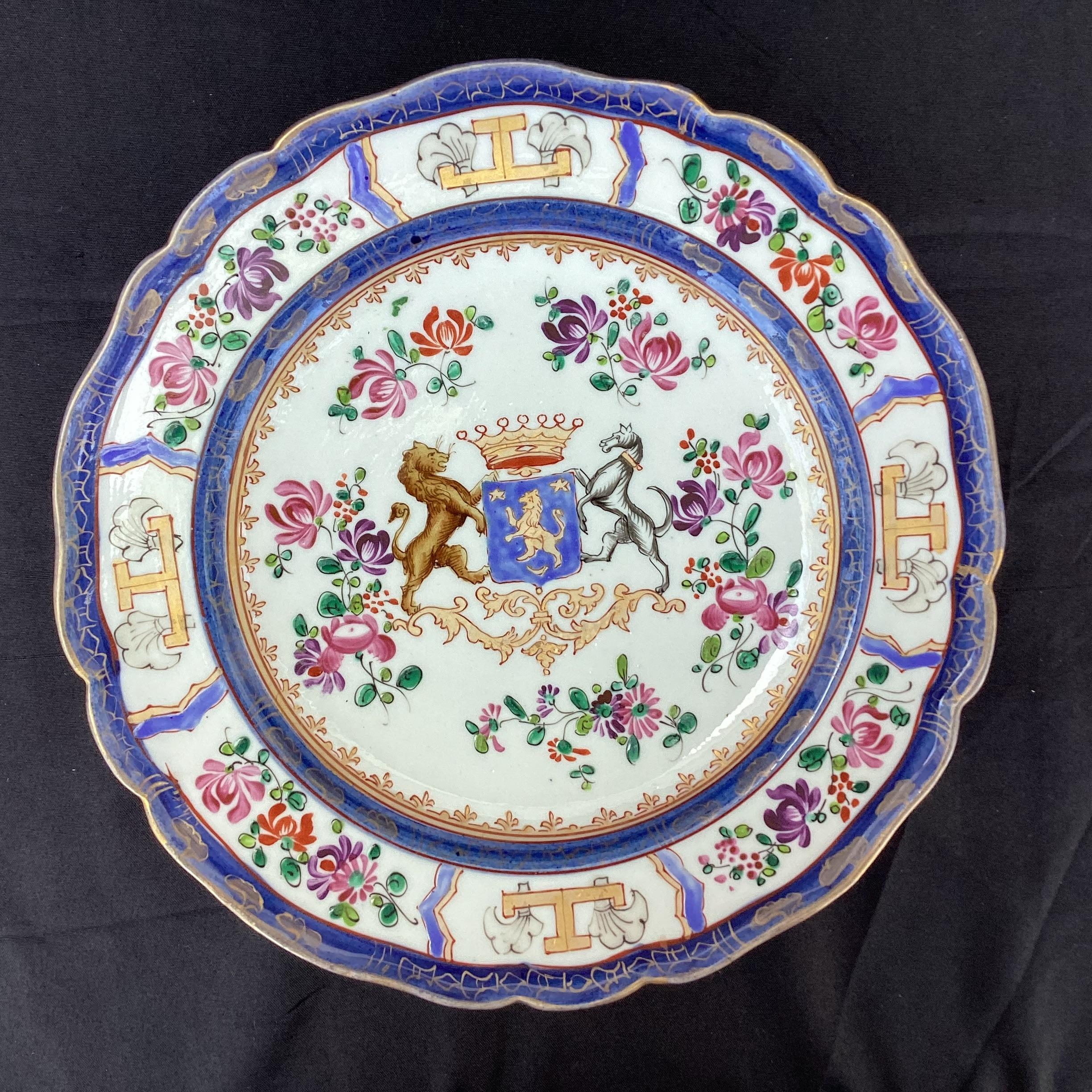 19th Century French Samson Chinese Export Style Armorial Porcelain Plates, Set of Four. Plates feature multi colors of blue, gold, pink on a white background. They bear an armorial and floral motif and were made by the Samson Porcelain Factory in