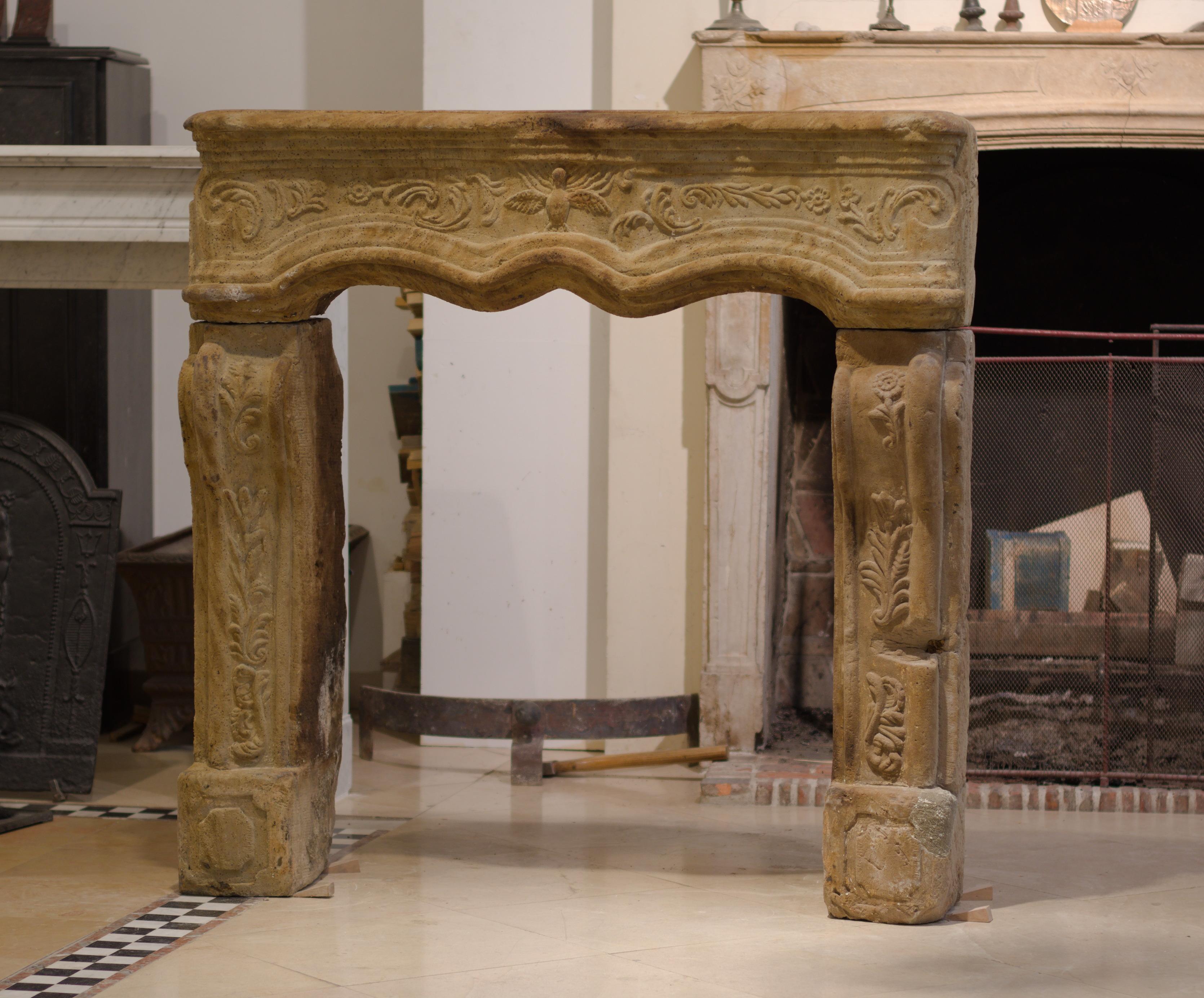 Happy to present this almost square amazingly detailed and warm colored French Régence fireplace from the late 18th century.
Its clear to see this mantel had a hard life, is has multiple big old restorations and some damages. The right leg might