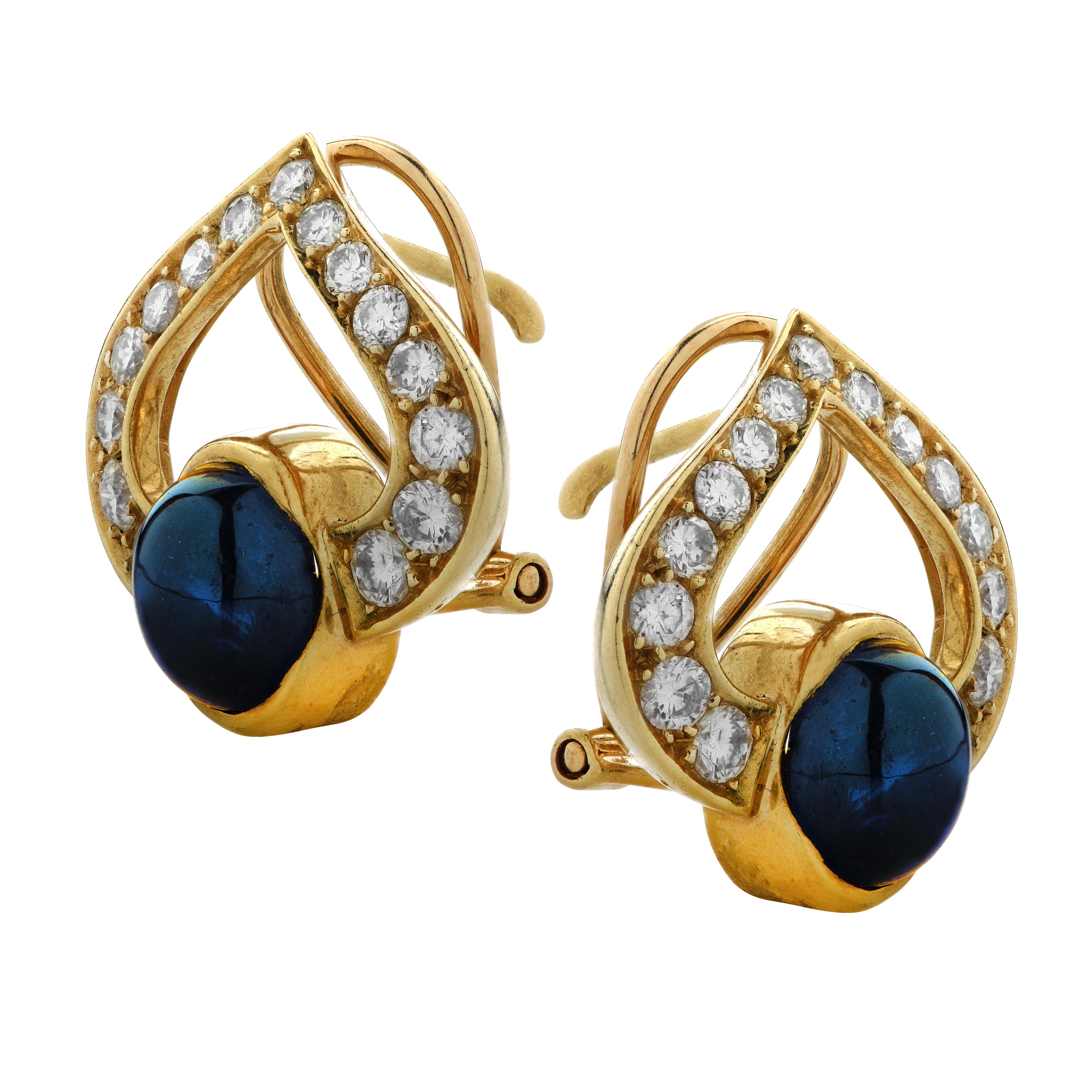 Delightful earrings crafted in France in 18 Karat yellow gold, featuring 30 round brilliant cut diamonds weighing approximately 1.50 carats total, G color, VS clarity, and two oval Sapphire cabochons weighing approximately 5 carats total. Two