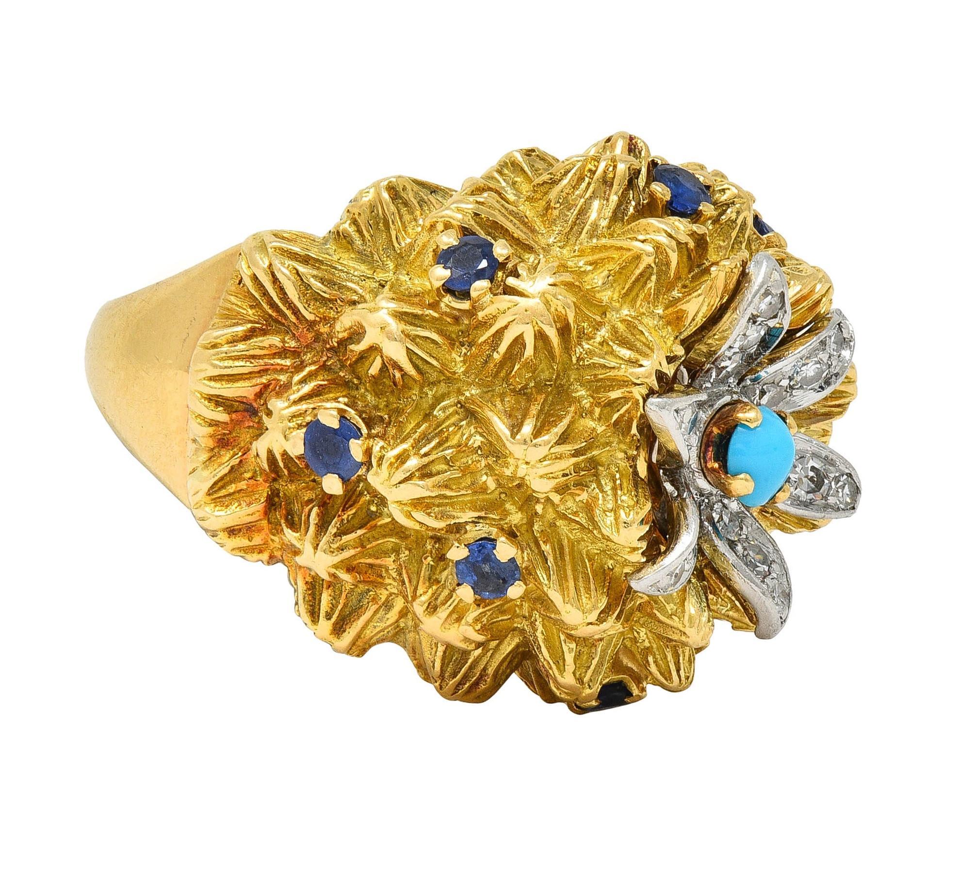 Designed as a domed form rendered as a stylized gold cactus centering a platinum flower 
With organically textured spiked gold surface accented by prong set sapphires 
Prong set throughout and weighing approximately 0.48 carat total - transparent