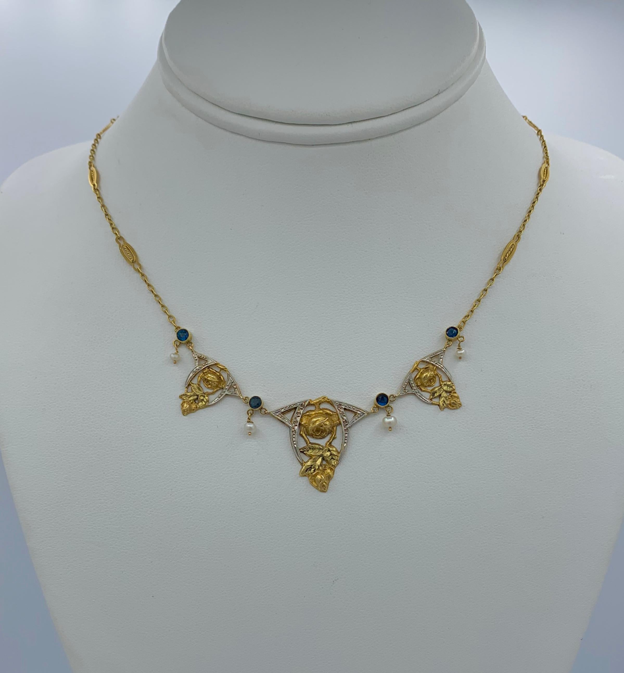THIS IS A STUNNING SAPPHIRE AND PEARL MUSEUM QUALITY FRENCH BEAUX ARTS NAPOLEON III BELLE EPOQUE NECKLACE IN 18 KARAT GOLD.  THE GORGEOUS NECKLACE FROM FRANCE HAS A STUNNING ROSE FLOWER GARLAND OPEN WORK WREATH MOTIF DESIGN AND IS SET WITH ROUND