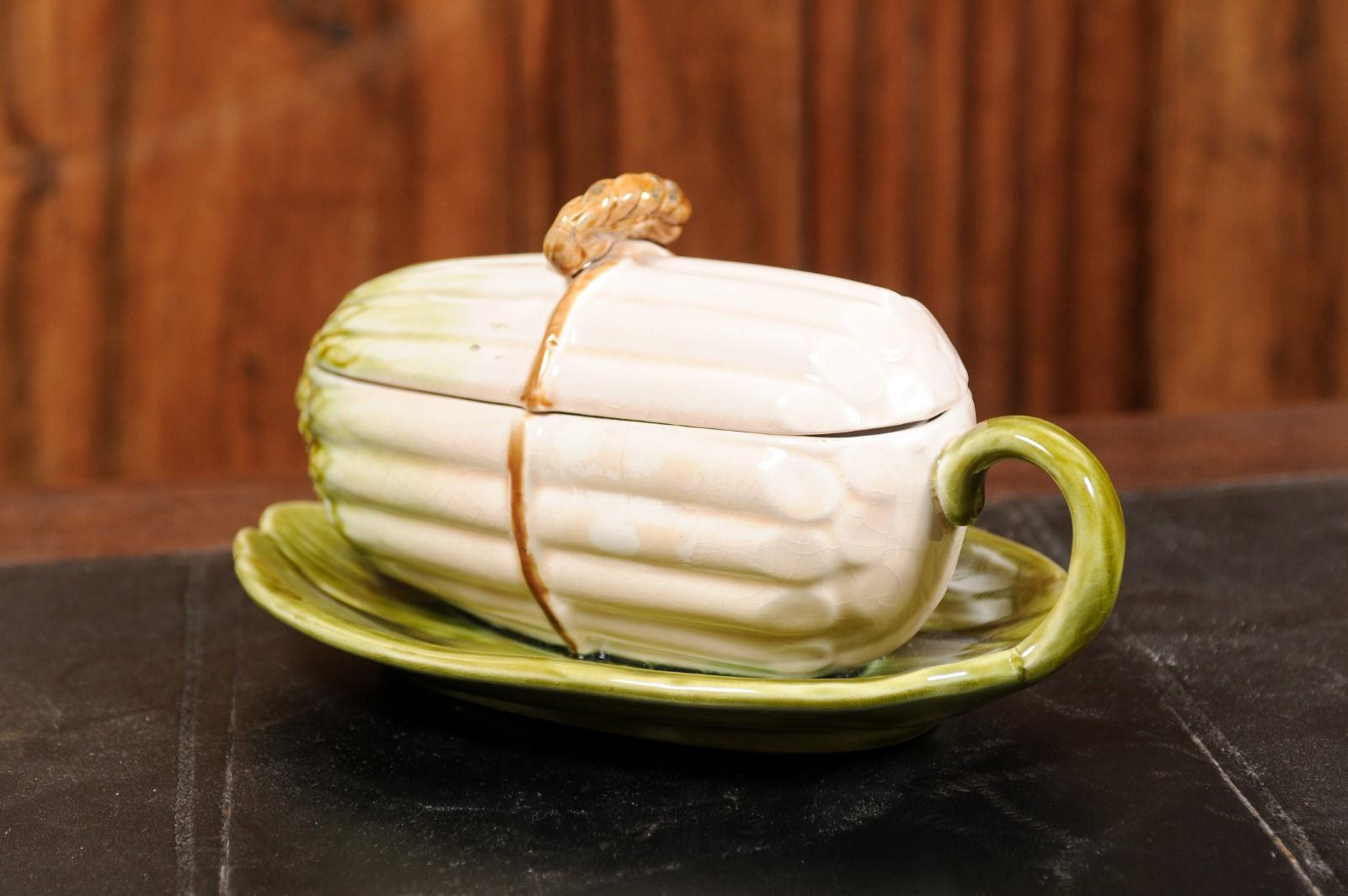 A French Sarreguemines majolica asparagus dish from the 19th century, with lid. Created in the Moselle department located in current Northeastern France, this Sarreguemines asparagus dish features an oblong body and lid depicting a bunch of