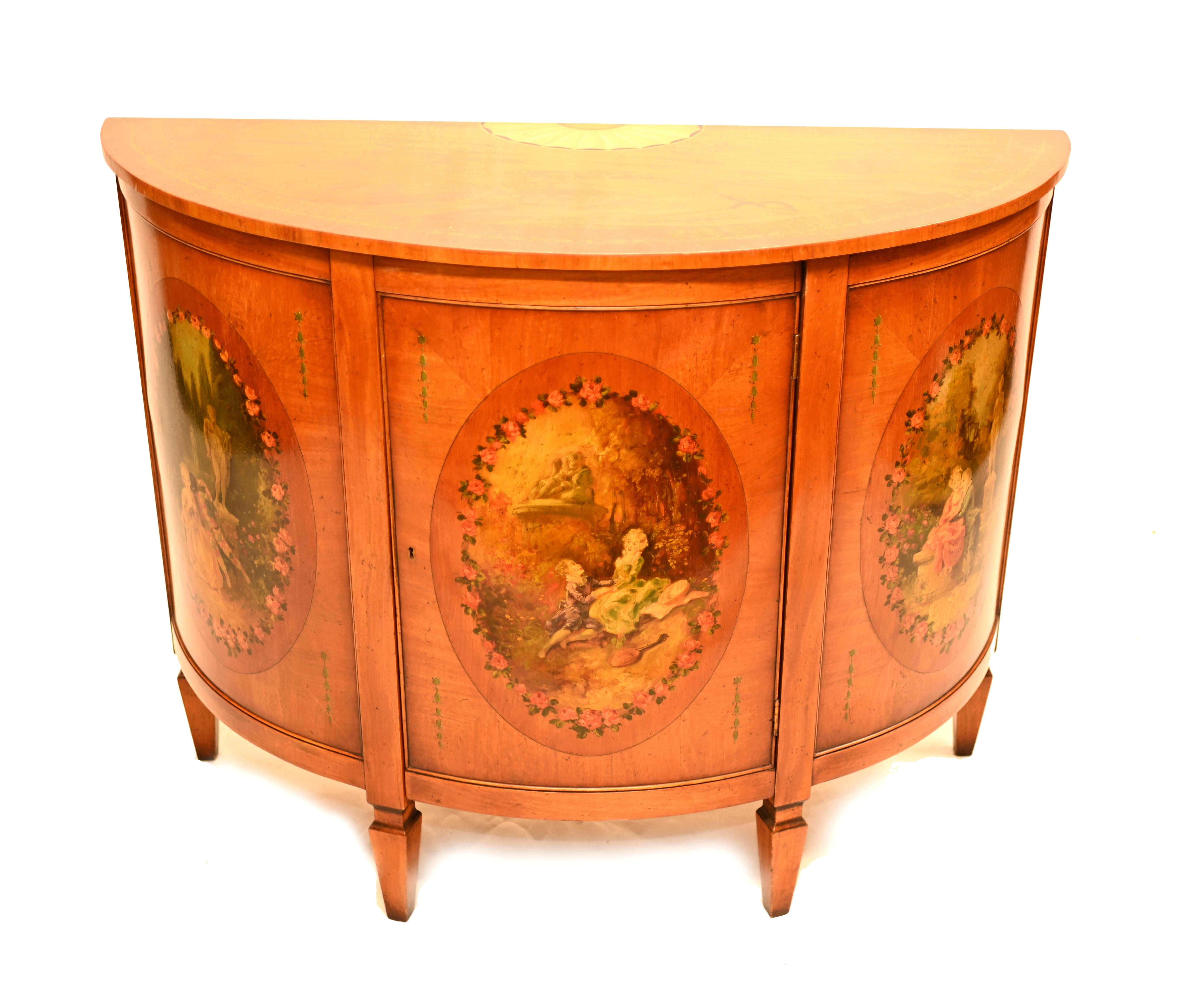 A Demilune satinwood commode painted the the Angelica Kaufman manner 
circa 1930
Painted features include romantic scenes of young lovers.
Bought from a dealer on Rue de Rossiers at the Paris antiques markets.

Offered in great shape ready for